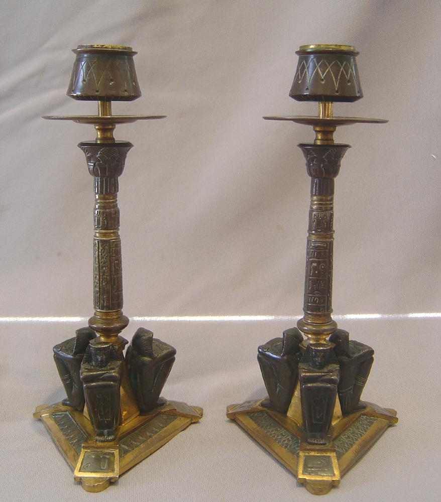 Patinated French 19th century Egyptian revival candlesticks in patinated bronze and ormolu For Sale