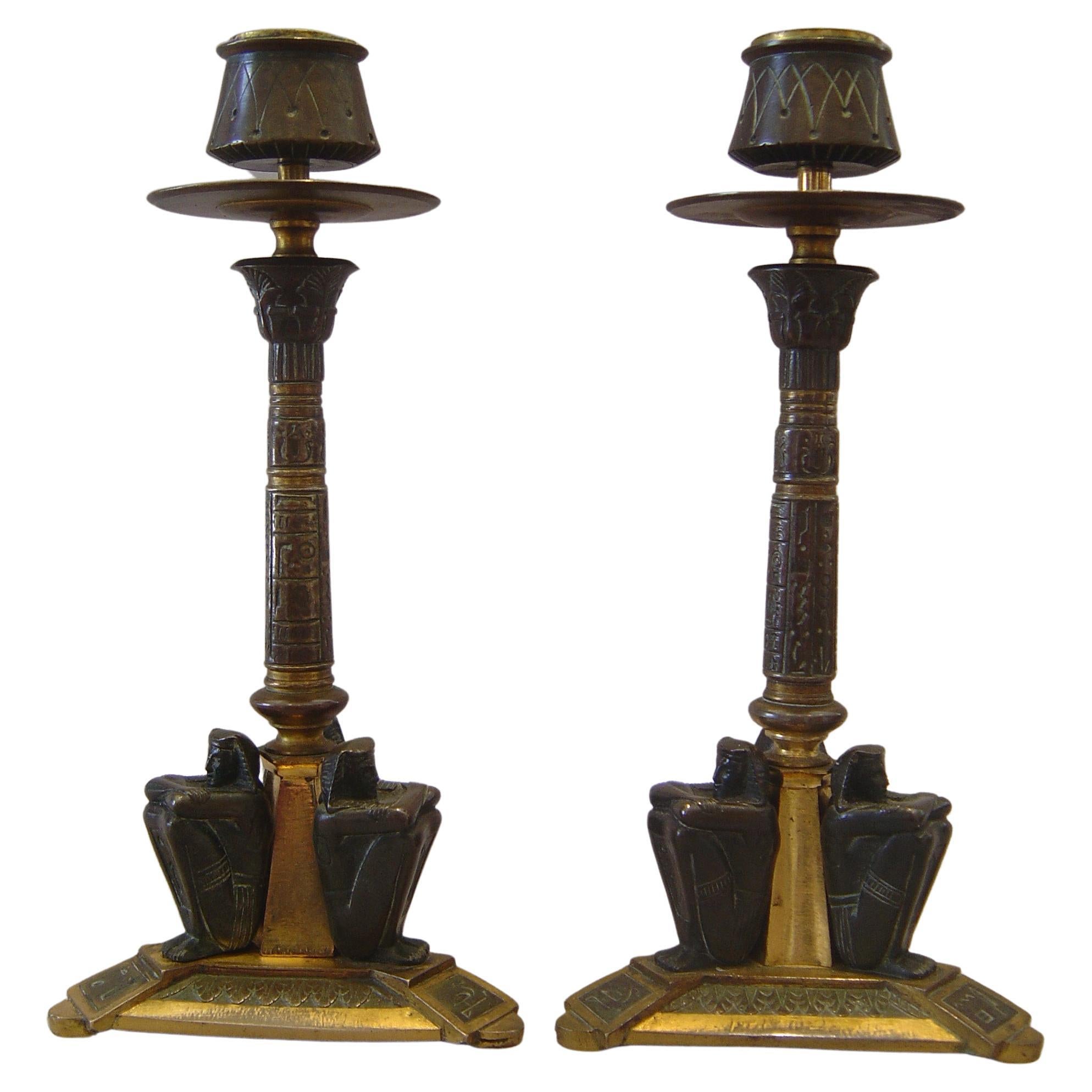 French 19th century Egyptian revival candlesticks in patinated bronze and ormolu For Sale