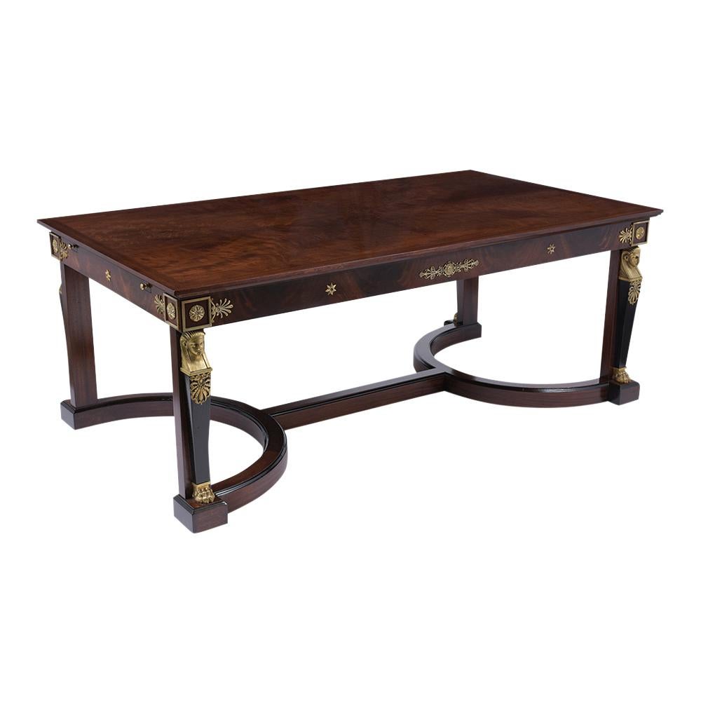 This mid-19th century French Empire Directoire Desk has been completed restored, is made out of mahogany wood, and this remarkable desk features a new rich dark mahogany and ebonized color combination with a lacquered finish. The desk is accentuated