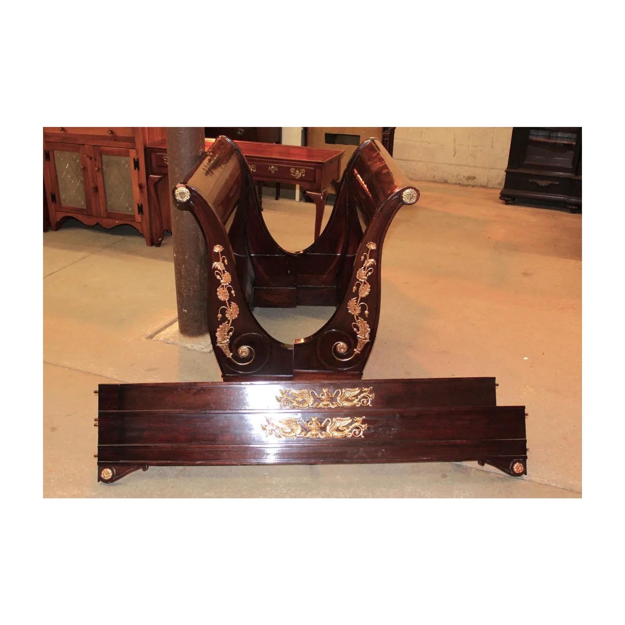 French 19th Century Empire mahogany twin size daybed with applied bronze decorations. Structurally sound with repair done on legs, see photos. Nice finish, bolt together construction. Use as a daybed, glamours sofa, or extra seating. Add some French