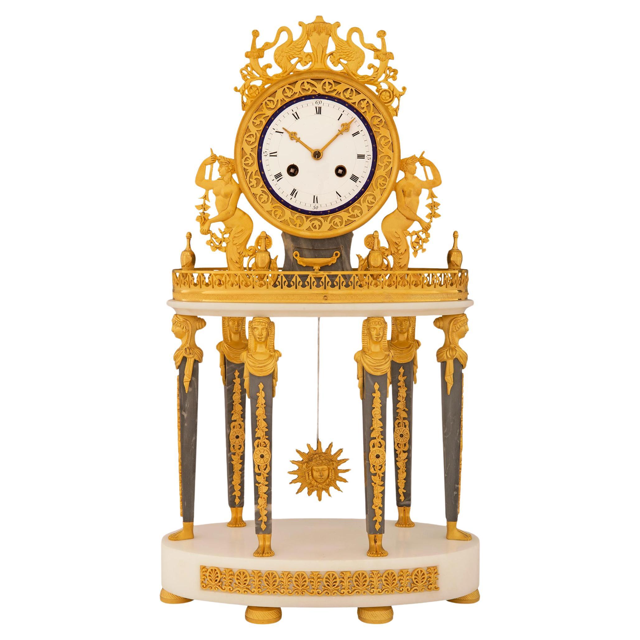 French 19th century Empire st. Gris st. Anne, Carrara marble, and Ormolu clock For Sale