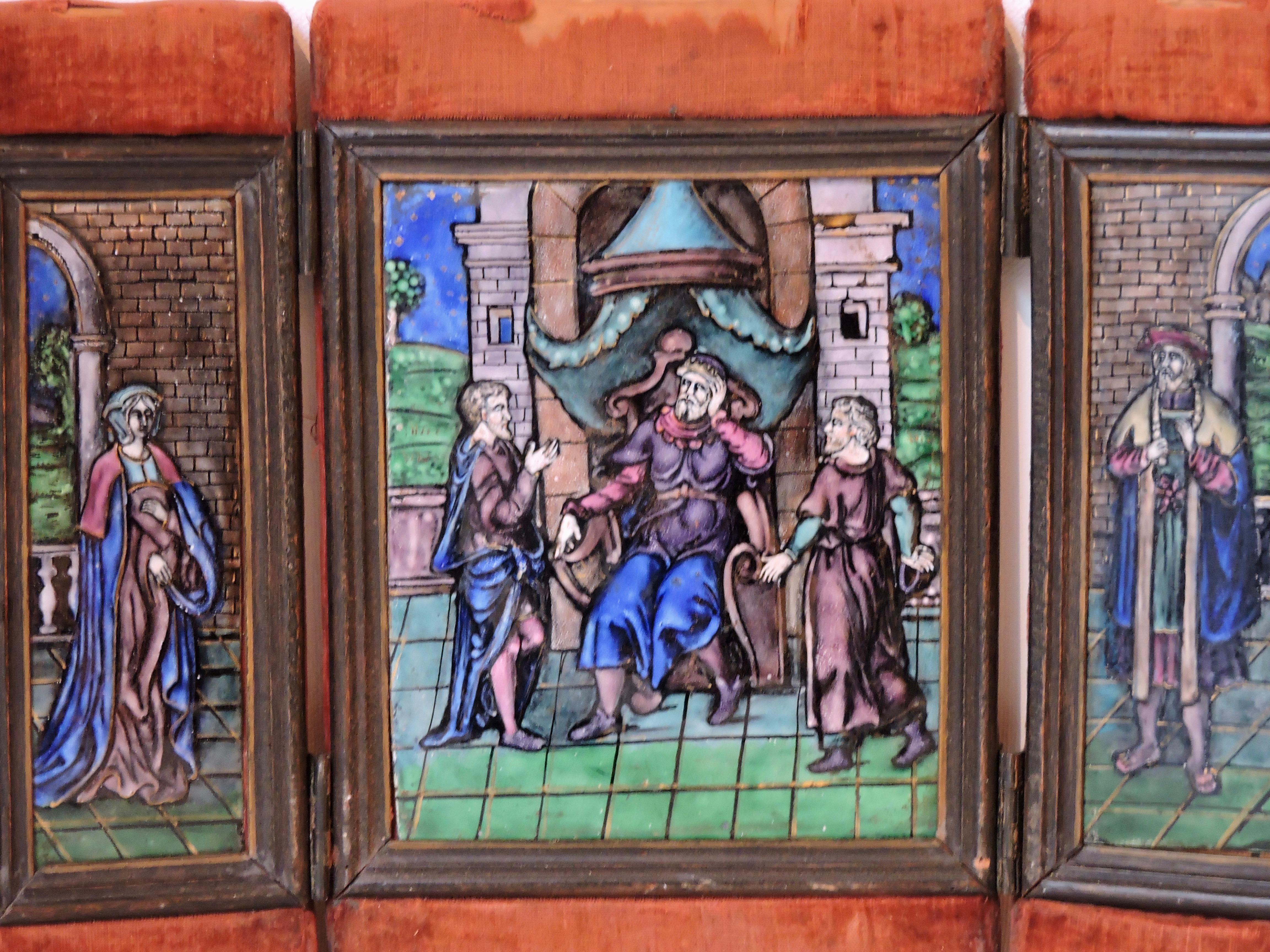 A French 19th century enamel on copper tryptic, circa 1880
Three polychromed enameled plaque representing a Renaissance scene with costumed nobles
Framed in three bronze panels on a red velvet opening frame, 
circa 1880.