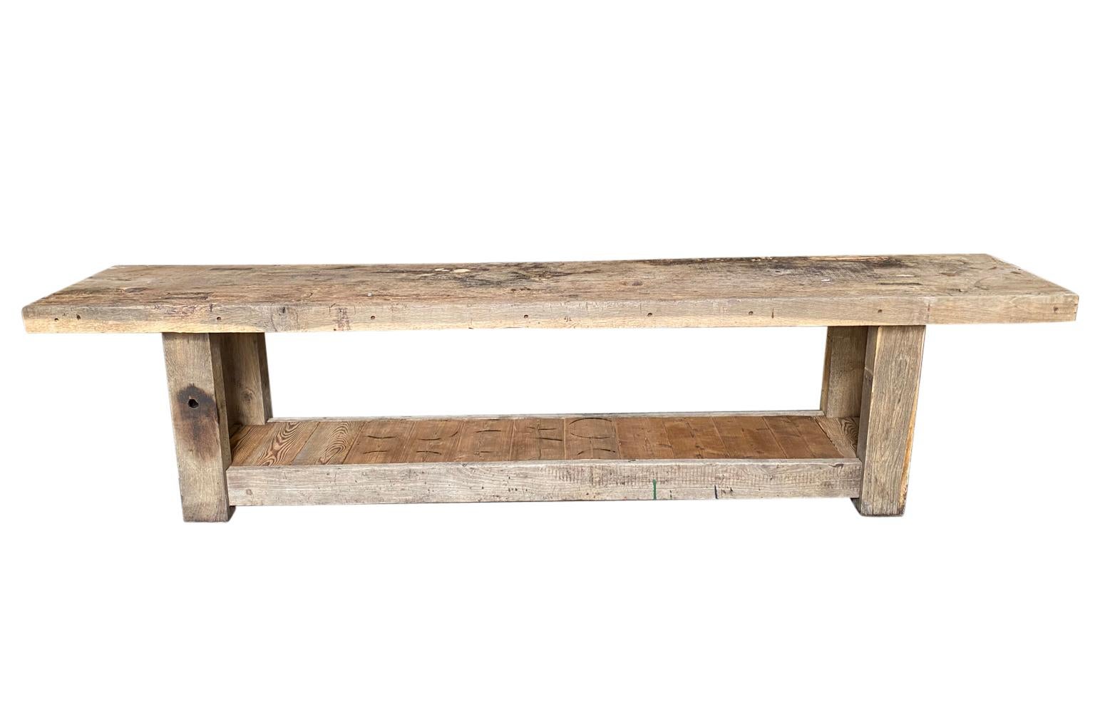 A very nice later 19th century Etabli - Work table from the South of France soundly constructed from naturally washed oak and pine. Wonderful as a console table or set up as a bar.