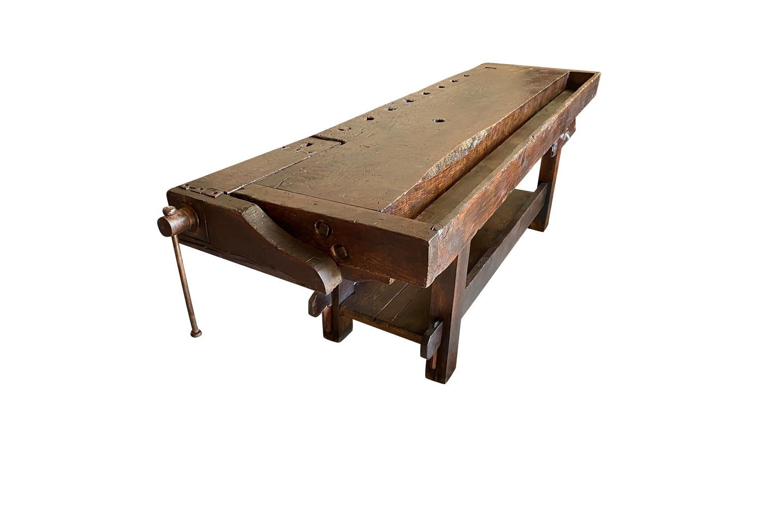 A very handsome 19th century Etabli - Work Table from the South of France.  Soundly constructed from richly stained oak and retaining its original vice.  Terrific as a console table.
