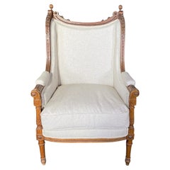French 19th Century Exquisitely Carved Walnut Bergere with New Upholstery