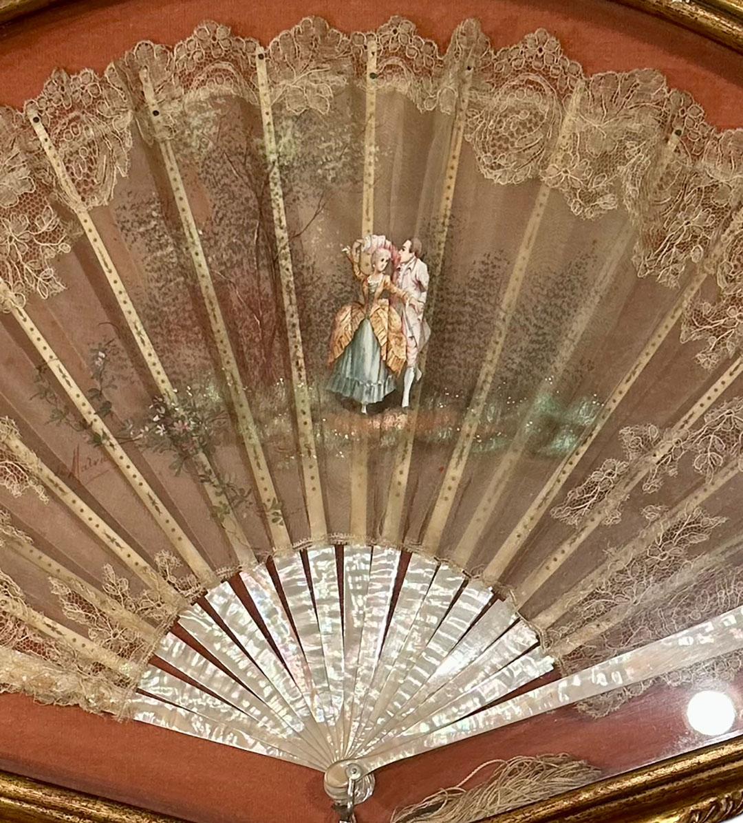 19th century French fan in an Italian Florentine fan case and the back is lined in velvet. The fan is hand painted, lace and mother of pearl. The case is turn of the century but fan is much older.