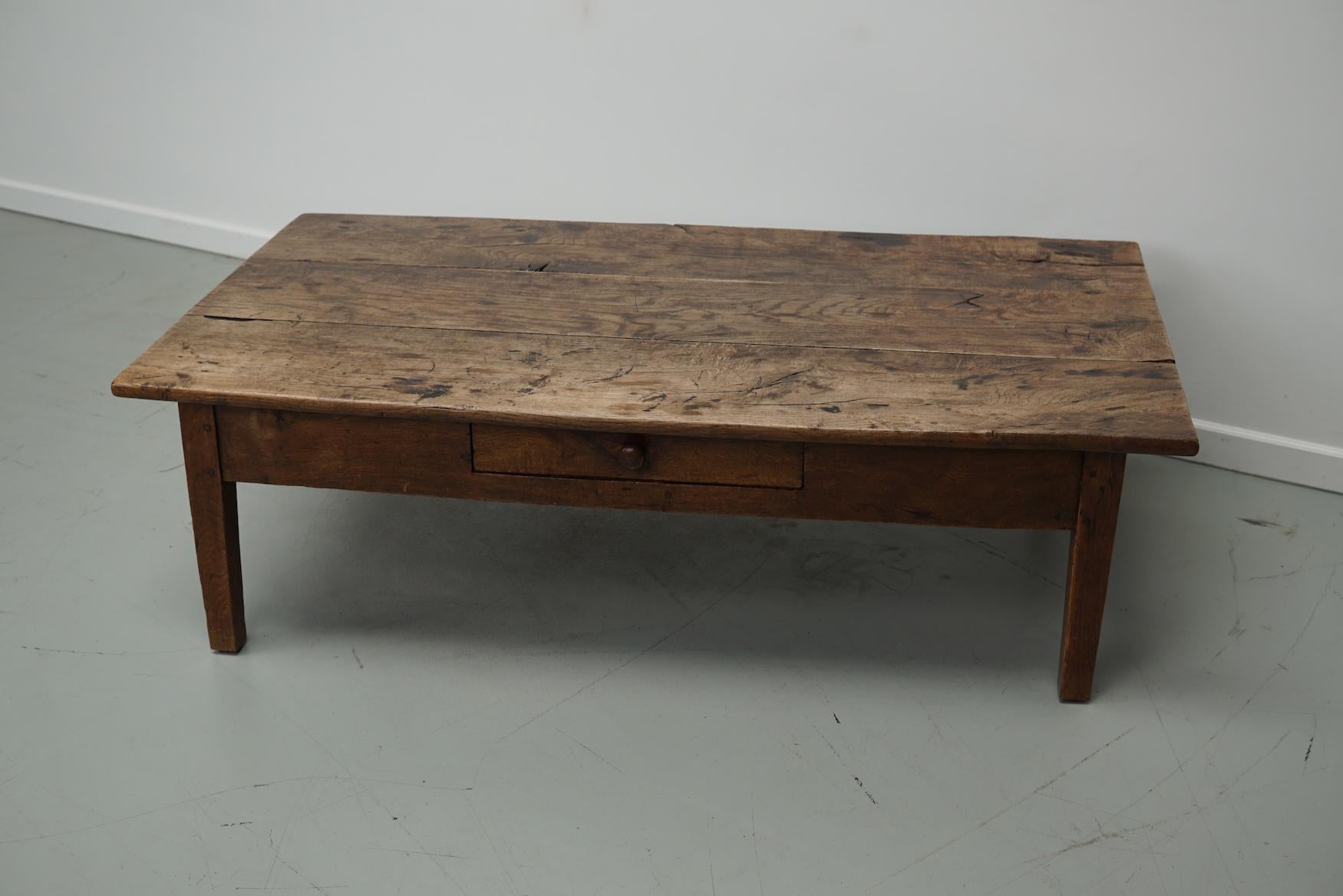 This coffee table was converted from an old 19th century chestnut farmhouse kitchen table. It retained a very nice patina and rich color / fading over the years and has a practical size.