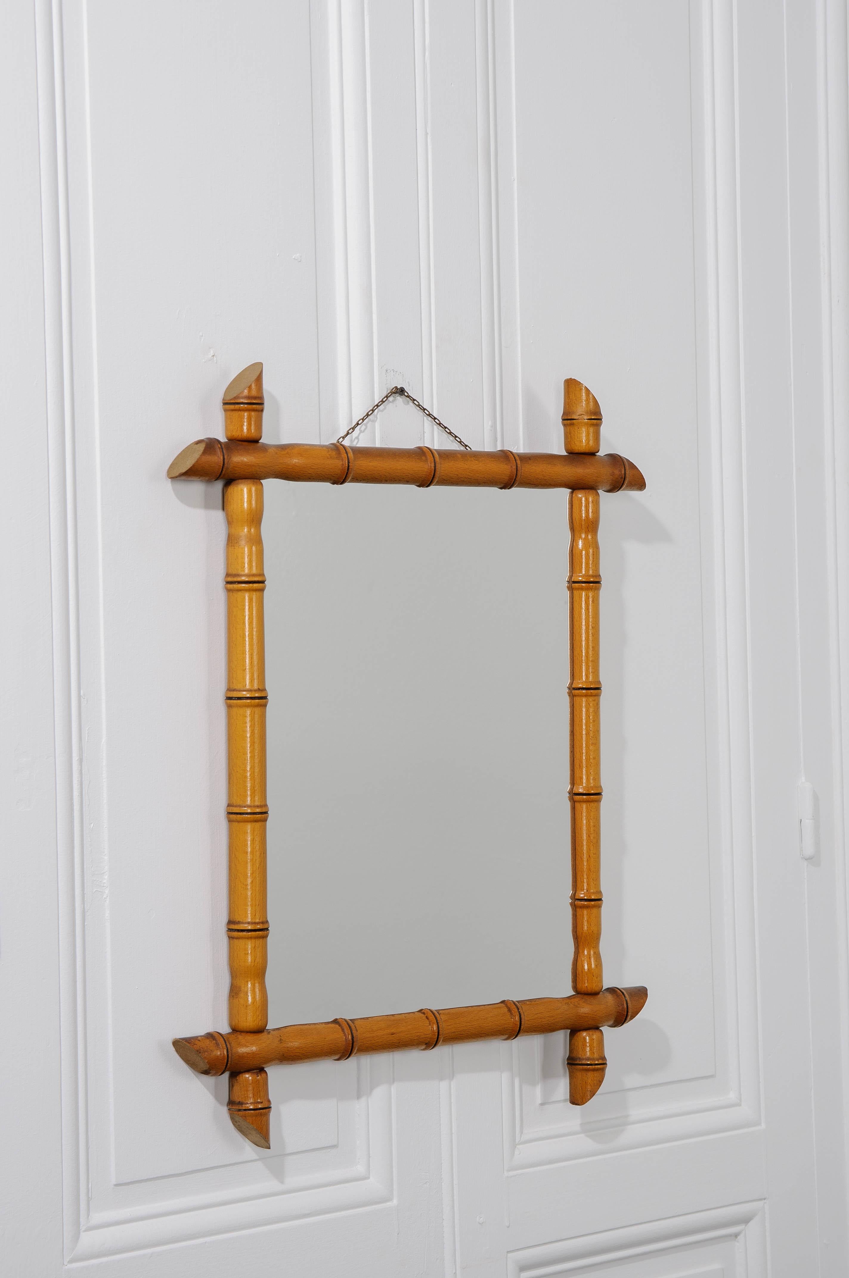 A French faux-bamboo rectangular mirror from the early 20th century is made of pine wood and has the original mirror plate.