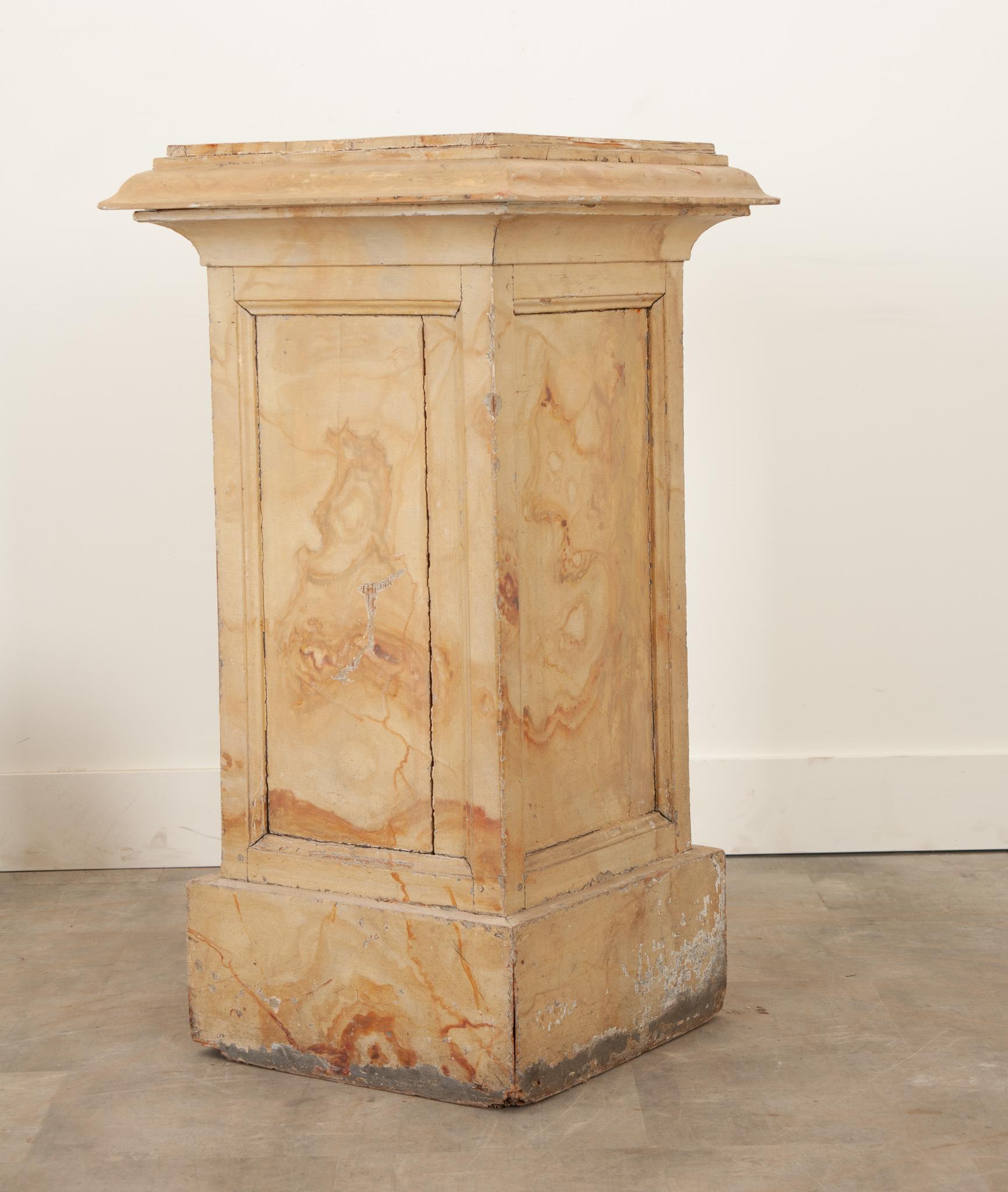 This colorful yellow, faux marble, paneled pedestal is a delightful size and very sturdy. It’s worn in all the right places and brings age and patina to any interior. Perfect for housing a sculpture or plant and easy to use all over the house. Be