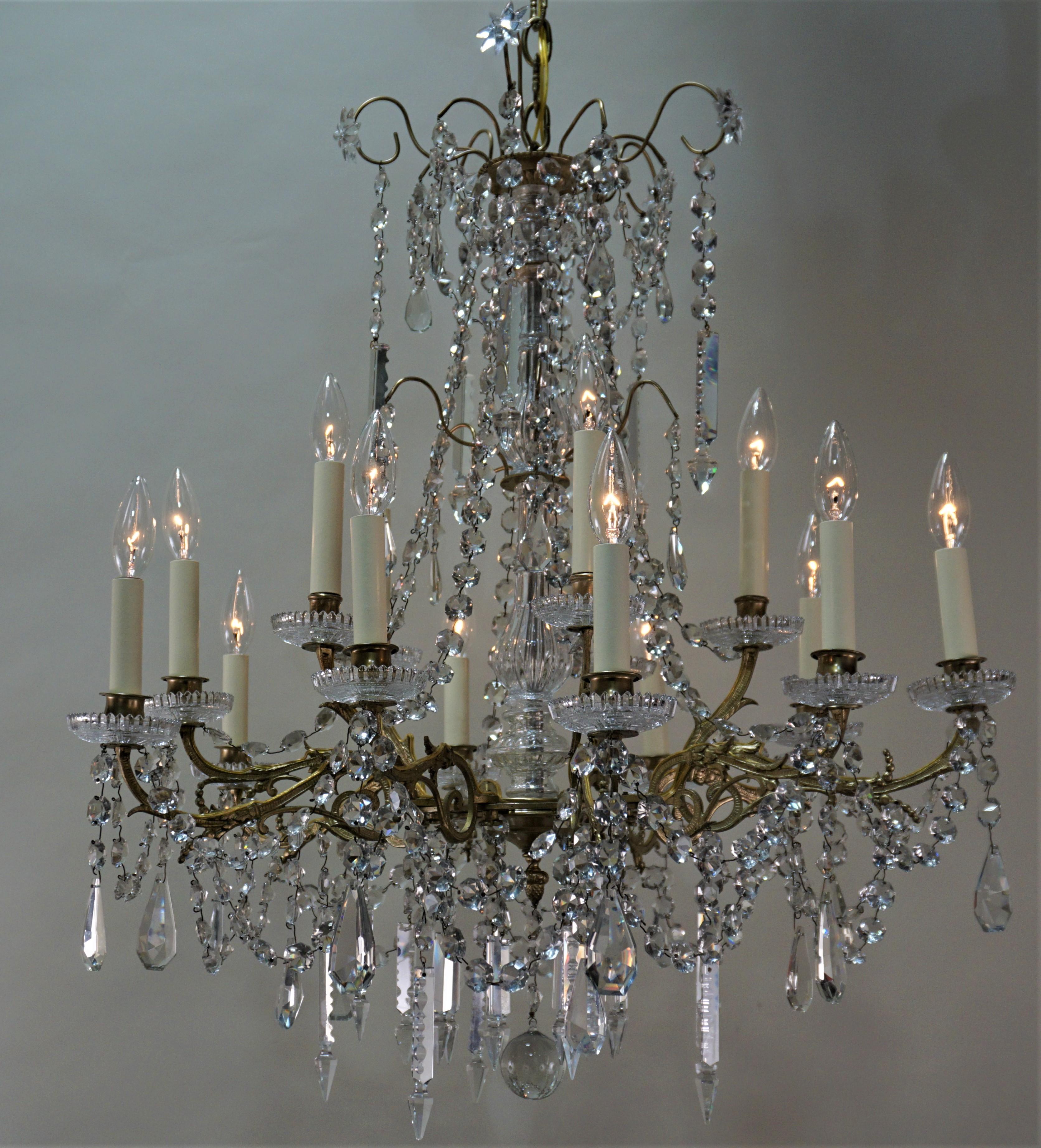 19 century fifteen-light crystal and bronze chandelier that has been electrified.
Minimum height fully installed with three links of chain is 36