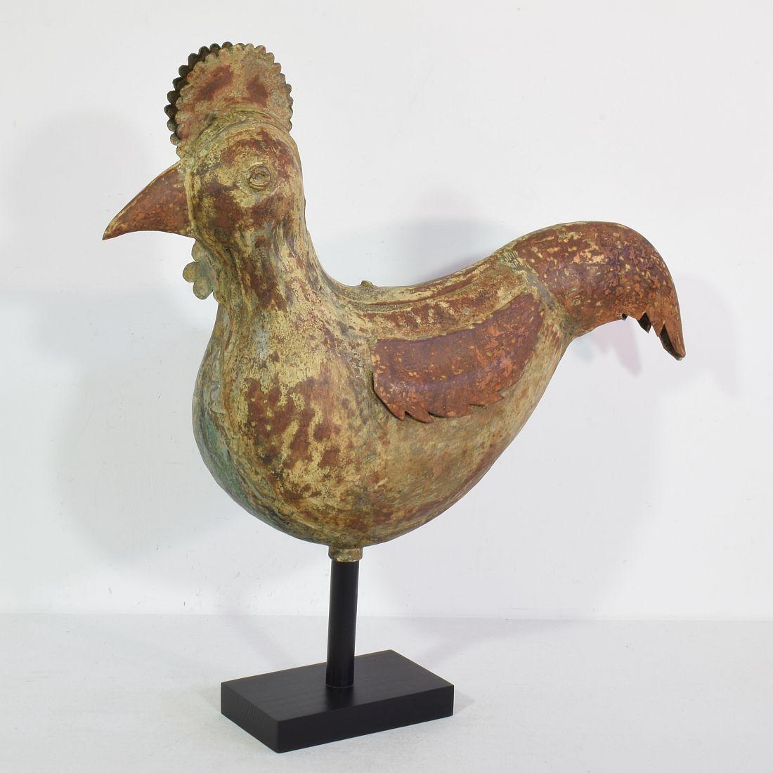 Beautiful metal weathervane representing a rooster or cockerel,
France, 1850-1900. 
Weathered and small losses. Measurement here below is inclusive the wooden base.
