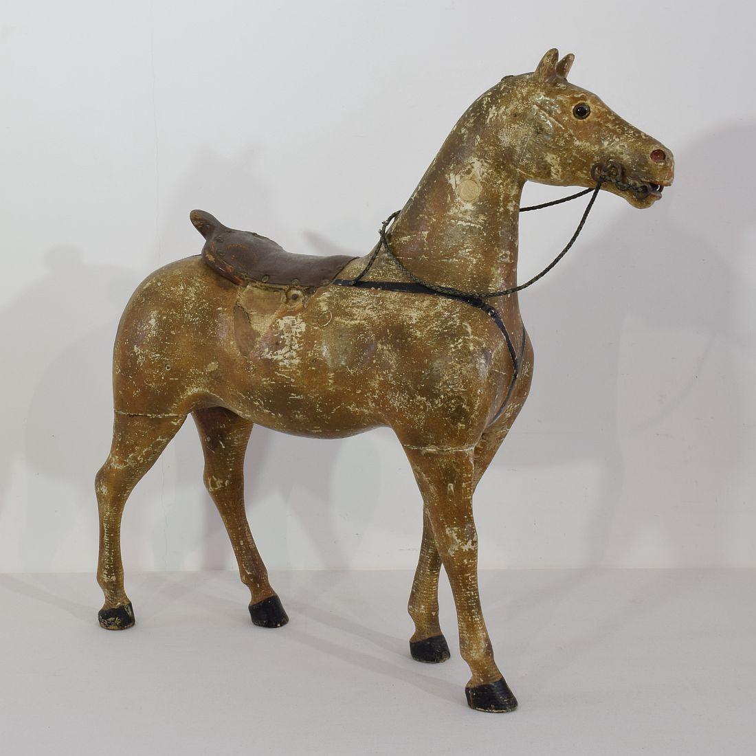 Beautiful wooden horse with glass eyes, France 19th century. Weathered, small losses.
  