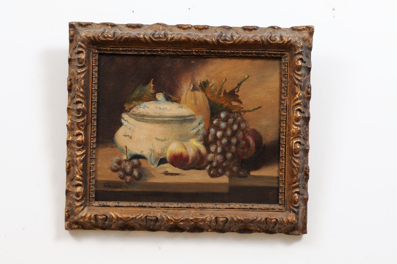 A French framed signed oil on canvas painting from the 19th century, depicting fruits and porcelain. Created in France during the 19th century, this framed still-life captures our attention with its depiction of mouth-watering peaches and grapes