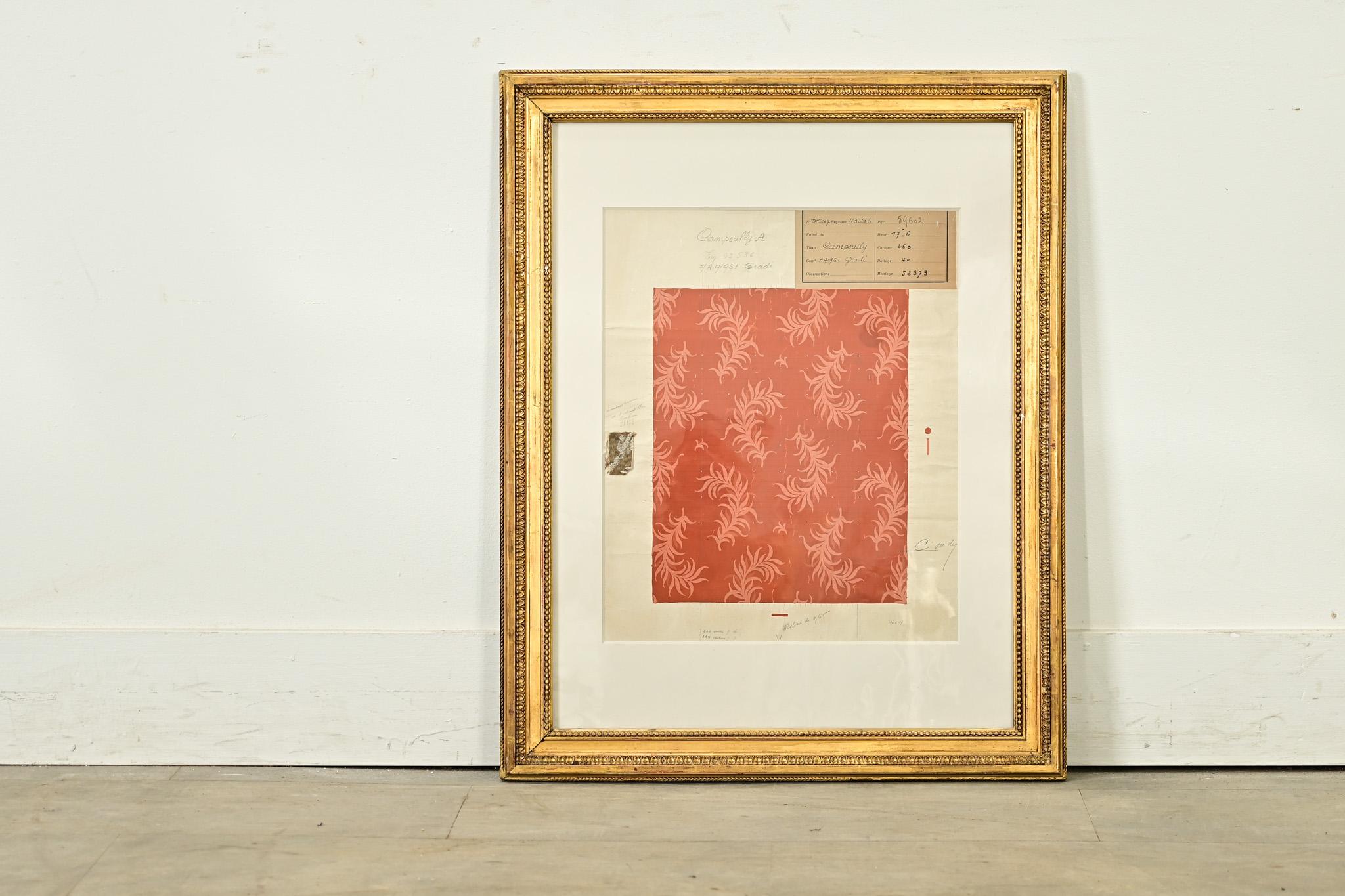 An original textile strike off from France (19th century) preserved in an antique gold gilt frame and antique wavy glass, recently mounted on archival-quality matting. This memento from the design process of creating a new pattern or colorway of