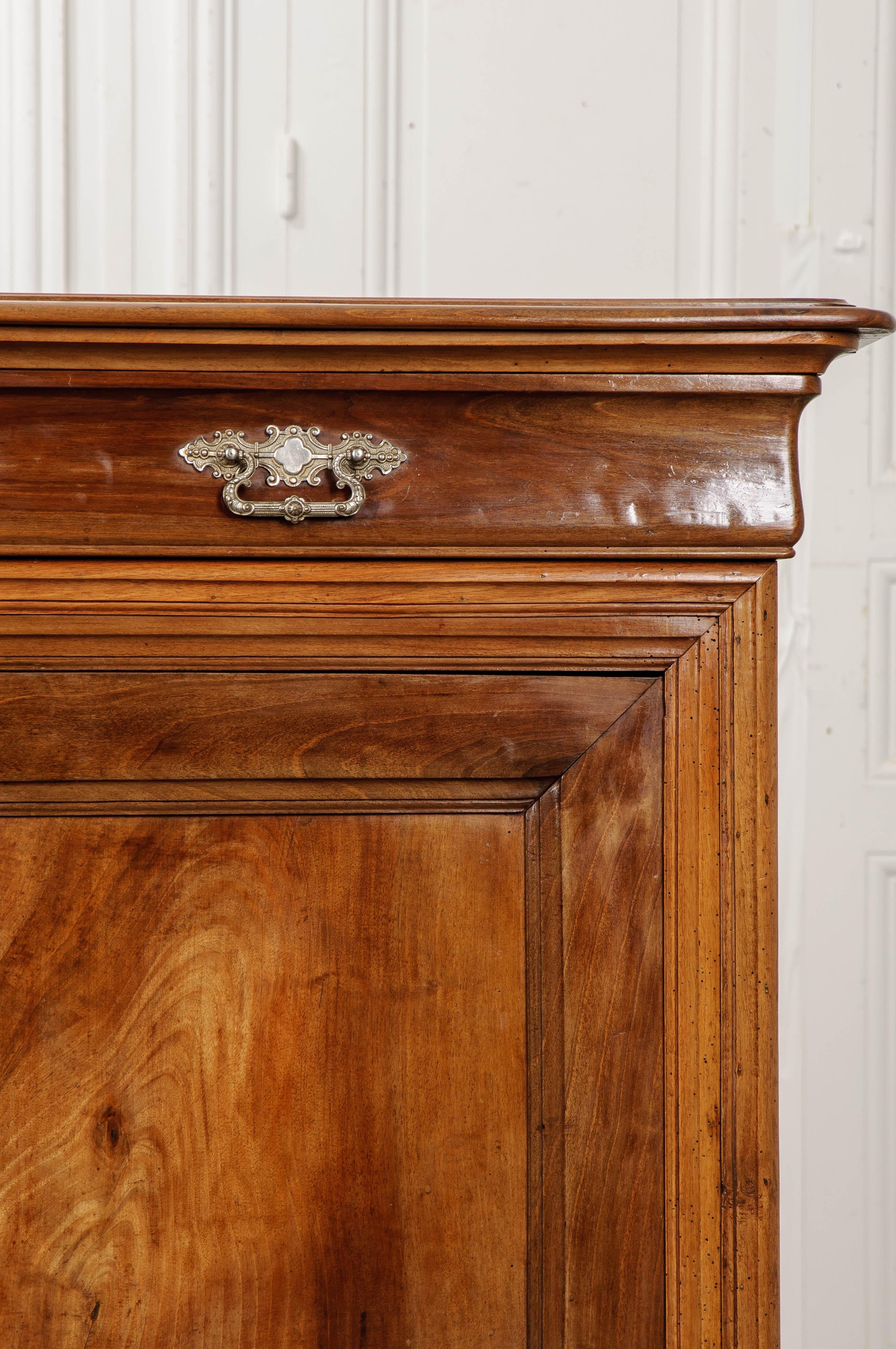 A delightful Louis Philippe fruitwood buffet, made in France, circa 1870. This wonderful antique buffet is teeming with Provincial charm. The solid antique fruitwood is beautifully toned and has been used to make beautiful, moulded trim that