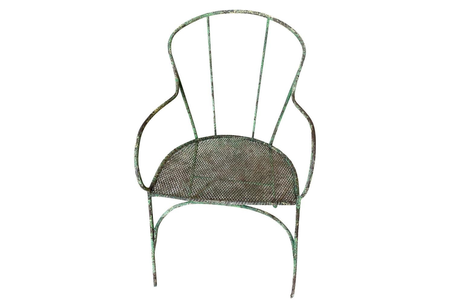 A very charming 19th century Garden Chair from the Provence region of France. Wonderfully constructed from painted hand forged iron. Seat height is 16 1/4