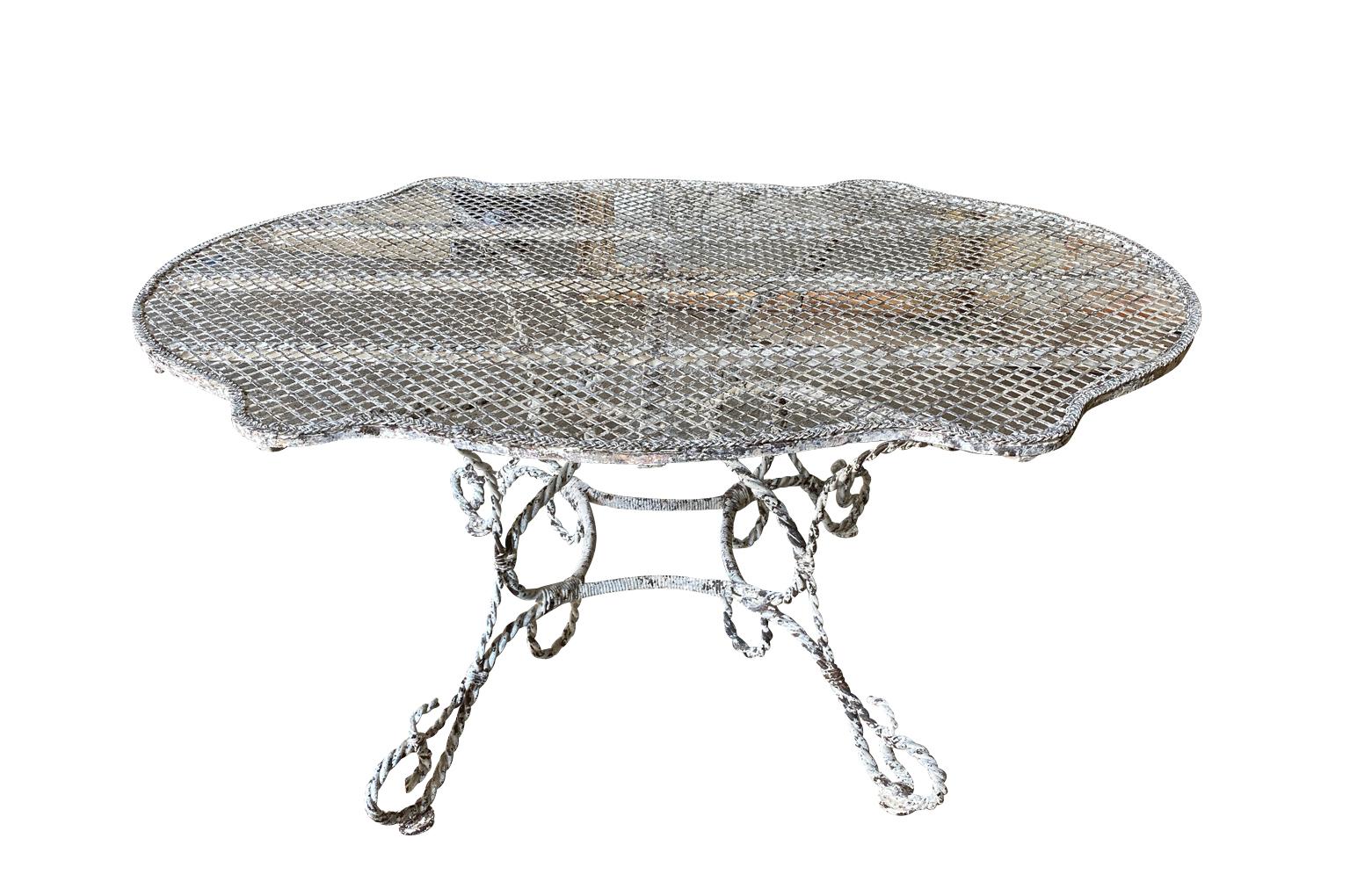 An exceptional 19th century Garden dining table from the Provence region of France. Beautifully constructed from painted iron with a very sculpted form. Perfect for any interior of garden.