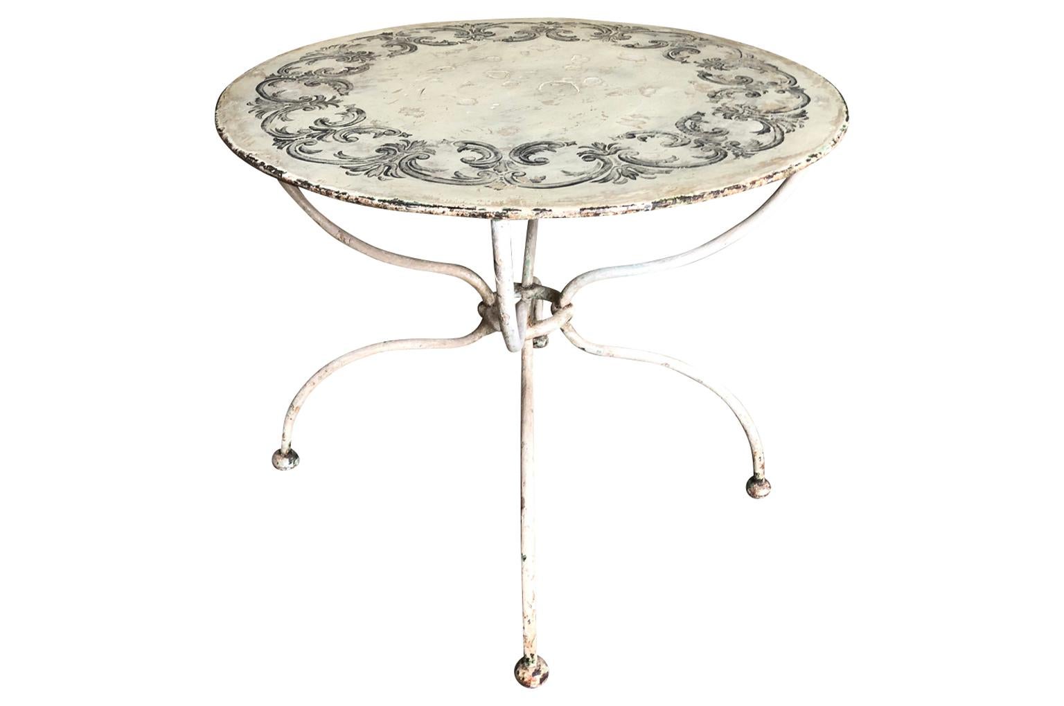 A very lovely later 19th century iron garden table with a fabulous painted finish. Perfect for any interior or garden.