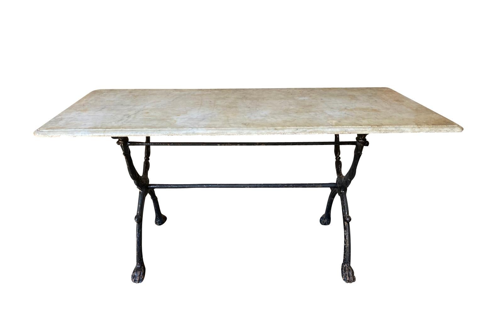 A very lovely early 19th century Garden Table from the Provence region of France. Soundly constructed with an elegant iron base with hoofed feet and its original marble top. Wonderful patina.