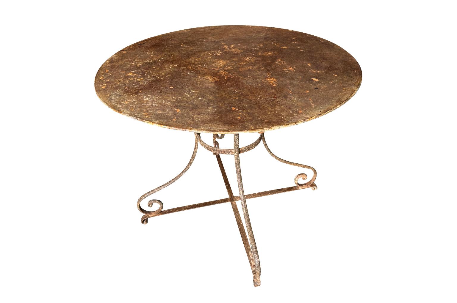 A very charming late 19th century Garden Table from the Provence region of France.  Beautifully constructed from iron with a sensational patina.  Perfect for any interior of garden.