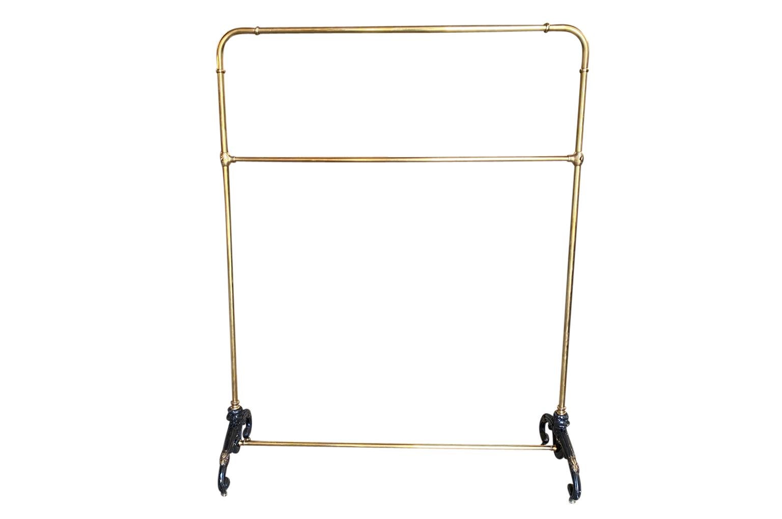 A wonderful late 19th century French Portant - Garment Rack origining from the House of Jeanne Lanvin in Paris,  Wonderful quality in brass and cast iron.  Perfect for a loft foyer, large master closet, restaurant or as a store display piece.