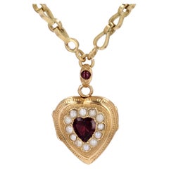 Médaillon et chaîne français du 19ème siècle en or jaune 18 carats avec grenats fins et perles