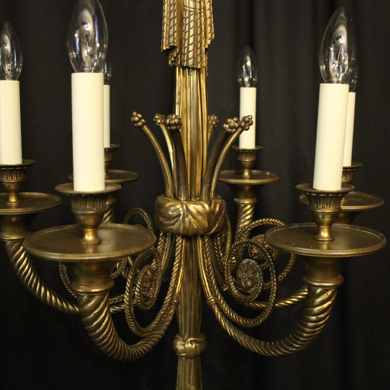 A quality French gilded bronze 6-light antique chandelier, the barley twist tapering scrolling arms with circular trumpet bobeche drip pans and bulbous reeded candle sconces, issuing from a decoratively cast elongated rope and tassel central column