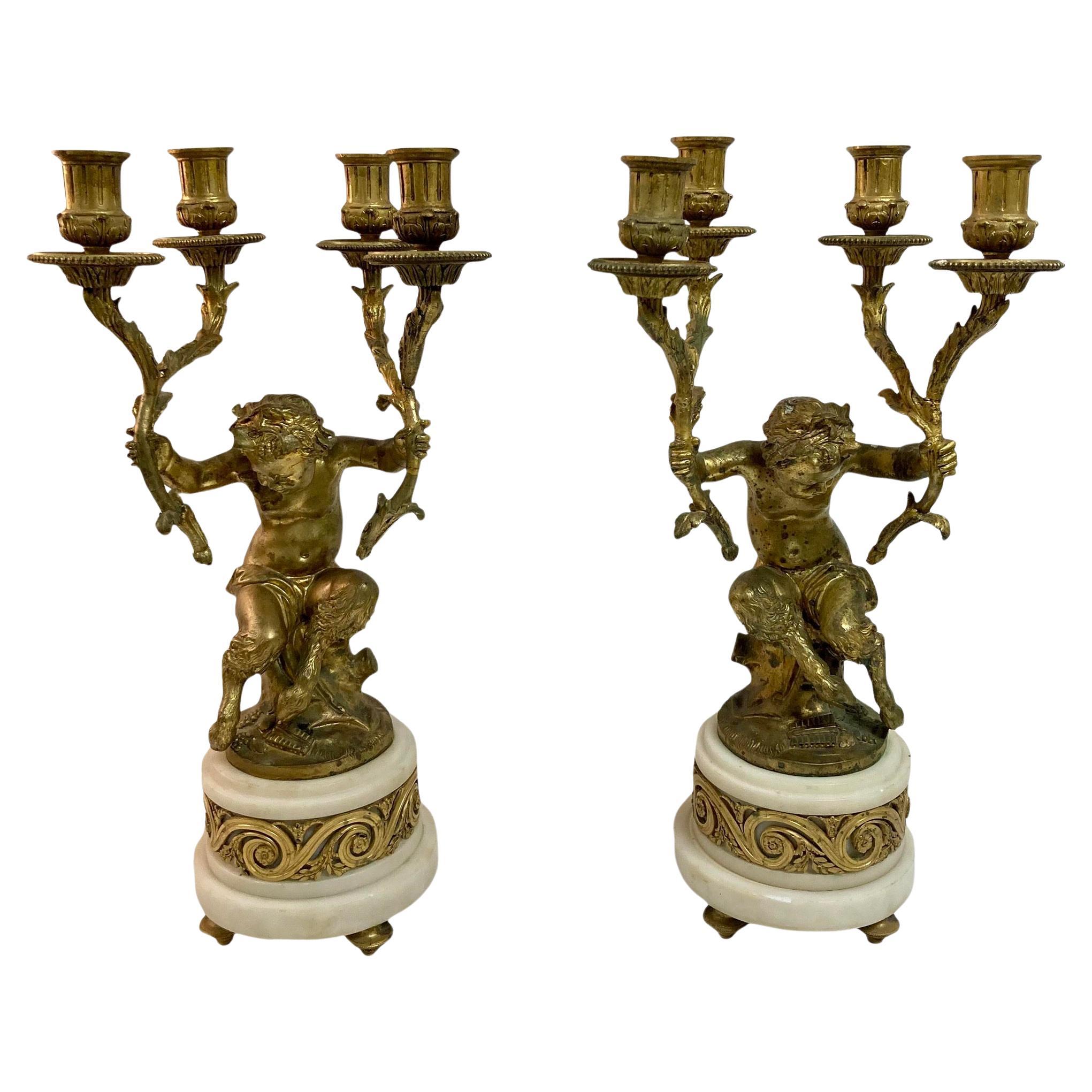 Paire de candélabres français Pan et Putti en bronze doré du 19ème siècle