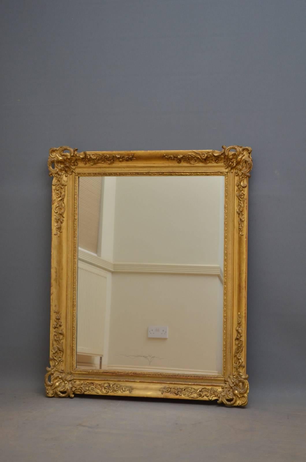 Sn4360, 19th century French mirror of versatile form could be positioned portrait or landscape, having original mirror plate with some foxing in beautifully carved and gilded frame. This antique gilt mirror is in wonderful original condition