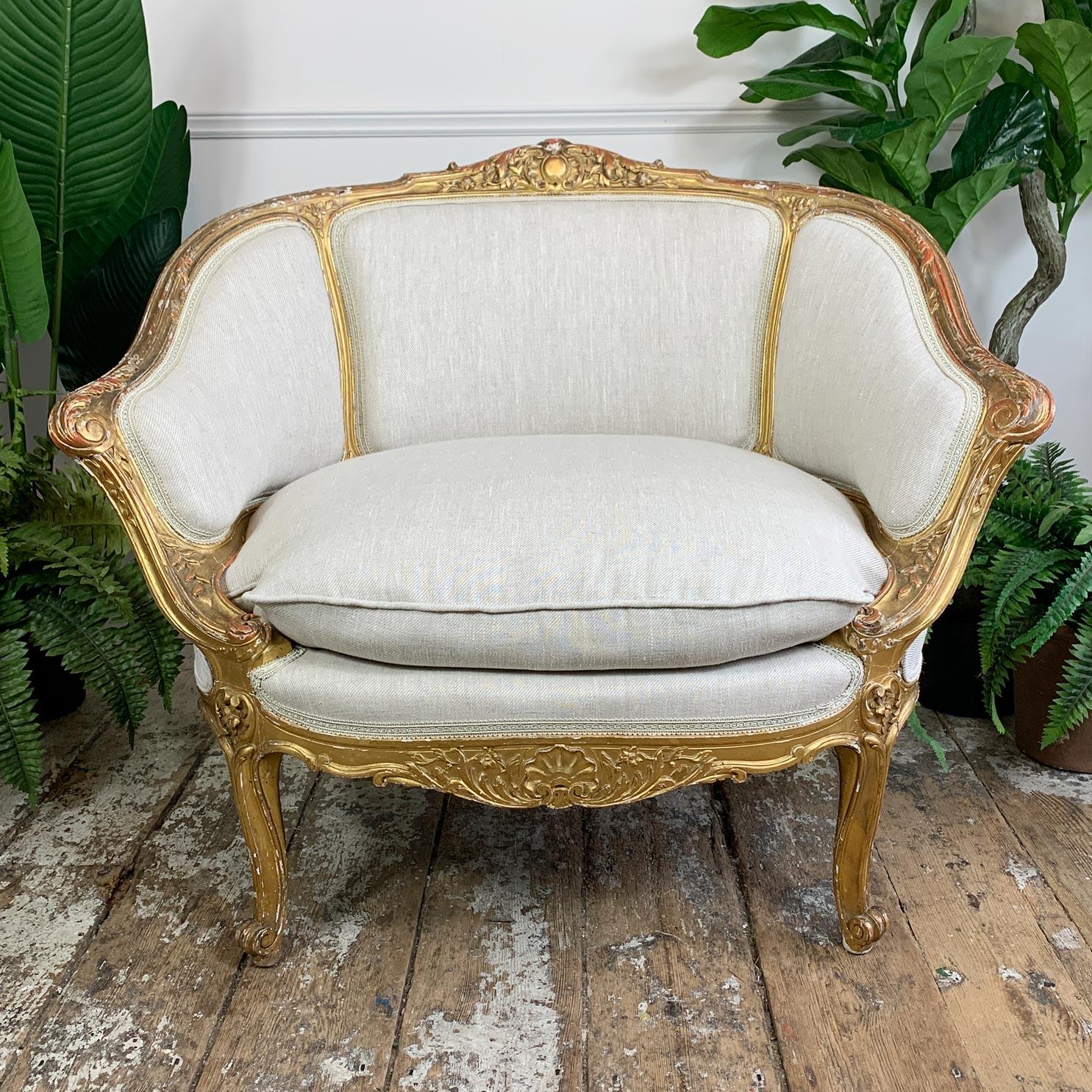 This rare and beautiful French Louis XV style fauteuil marquise chair, which is often referred to as ‘The Queens’ chair, is of carved giltwood construction and has been recently fully professionally reupholstered in a luxurious oatmeal linen. The