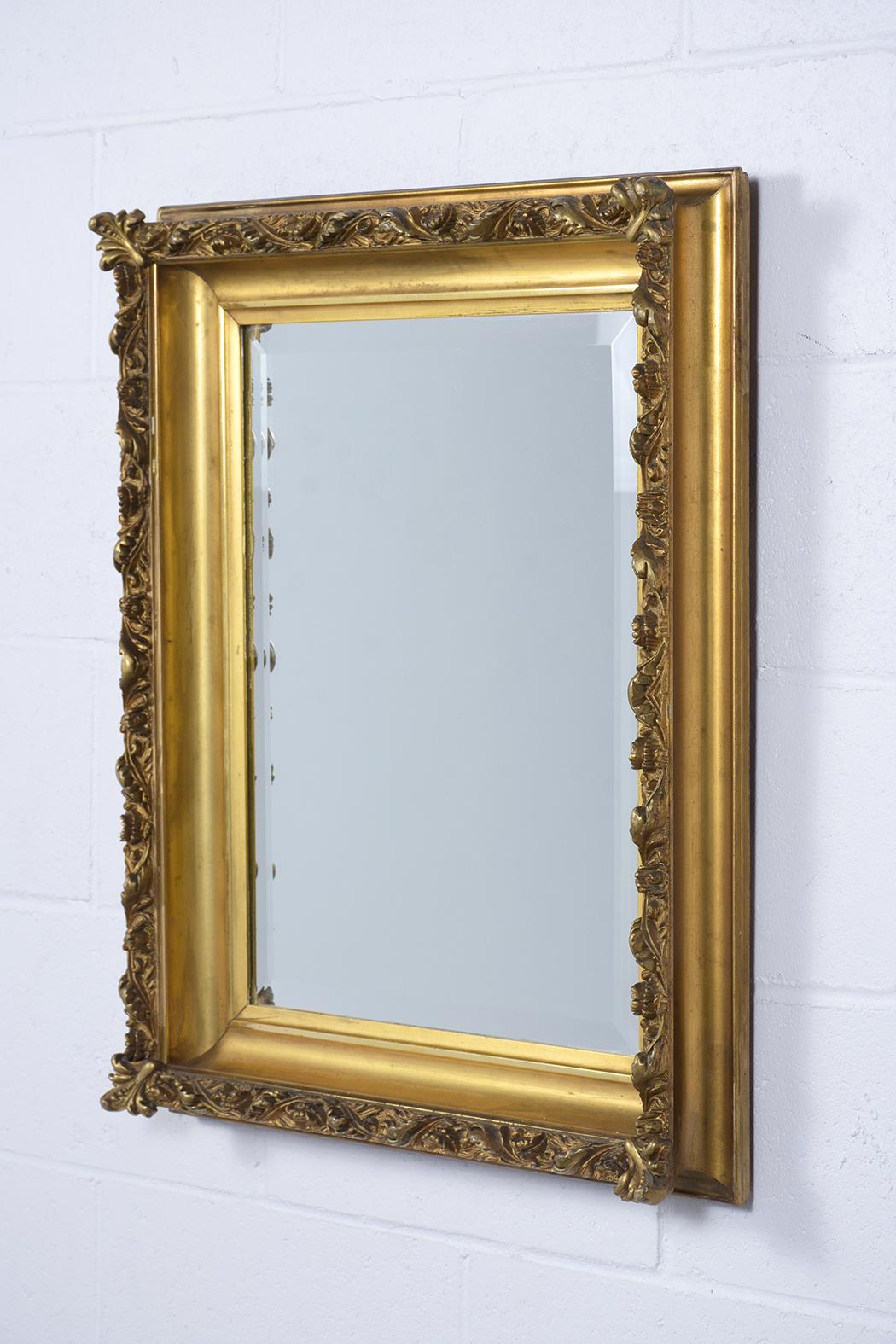 An extraordinary Antique French Henry II Wall Mirror features a giltwood carved frame and rectangular bevel mirror in the center that is fully reflective. This elegant Late 19th-Century Gilt Mirror is ready to be used and displayed for years to