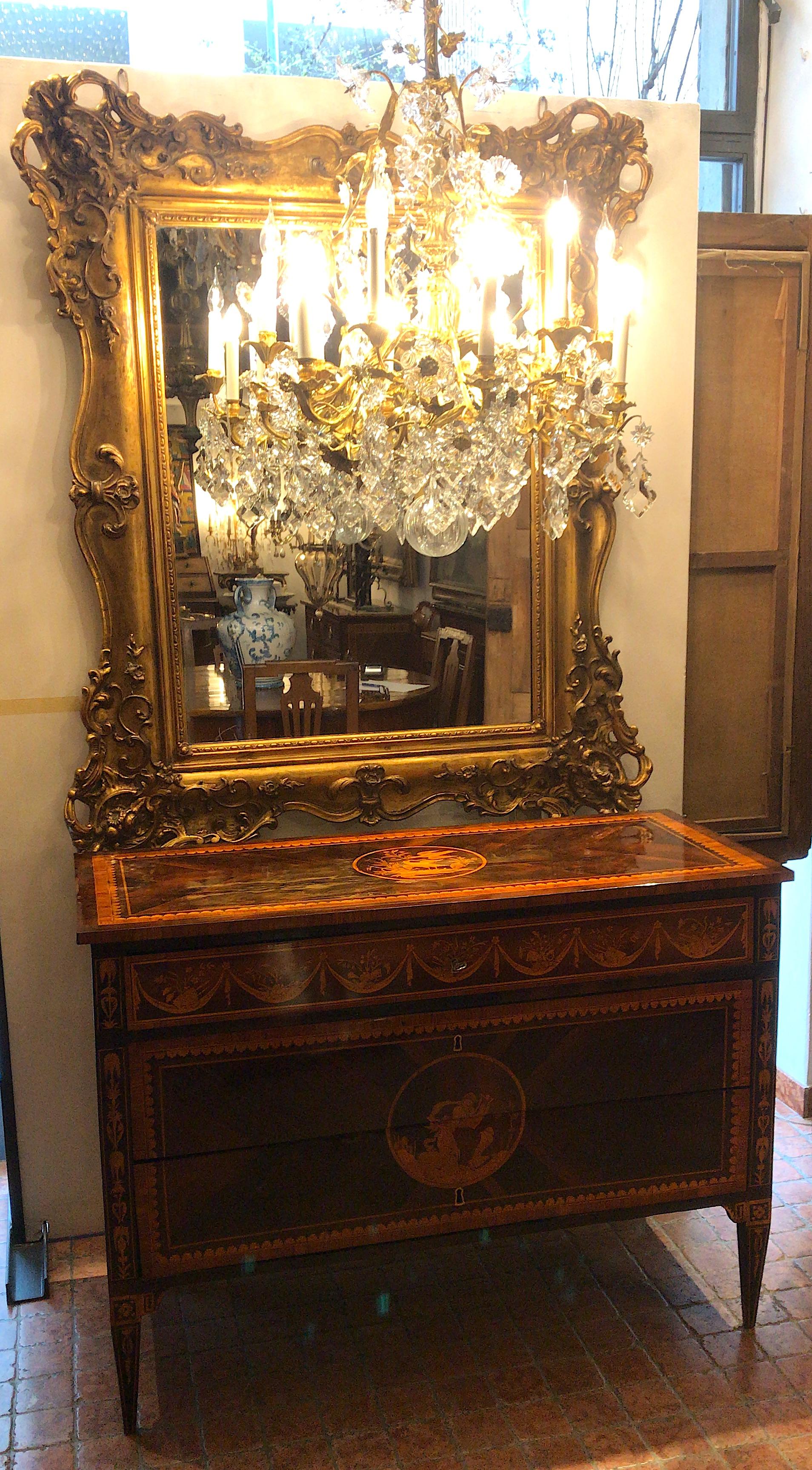 French 19th century giltwood mirror decorated throughout with foliate scrolls and floral leafted gilt gesso relief ornaments. Original and rare mercury glass plate.
French origin, this antique rectangular mirror was hanged in a private residence in