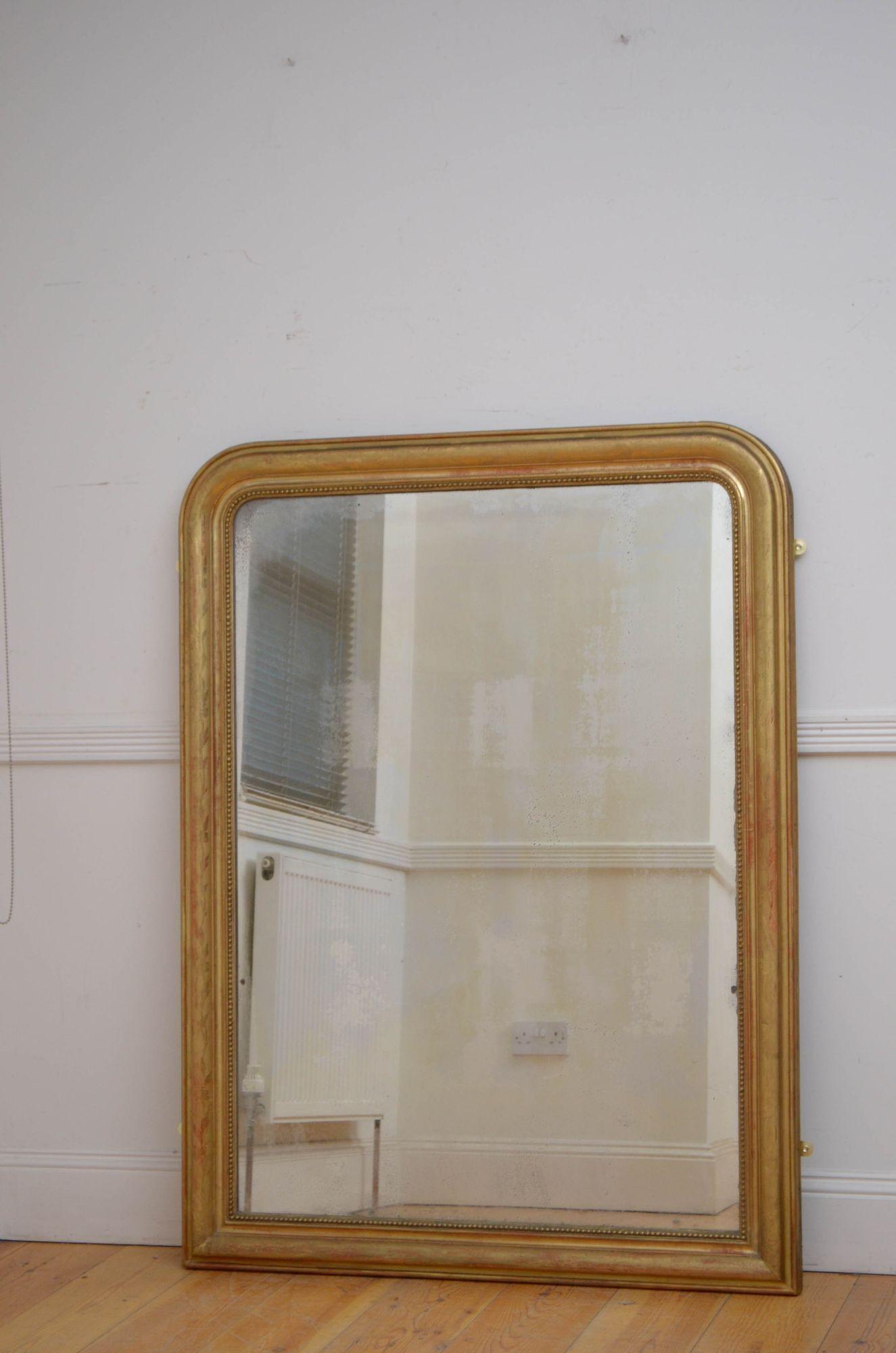 Sn5477 Attractive XIXth century gilt wall or pier mirror, having original glass with some imperfections, in beaded and moulded frame with floral decoration throughout. This antique mirror retains its original glass, original gilt and original
