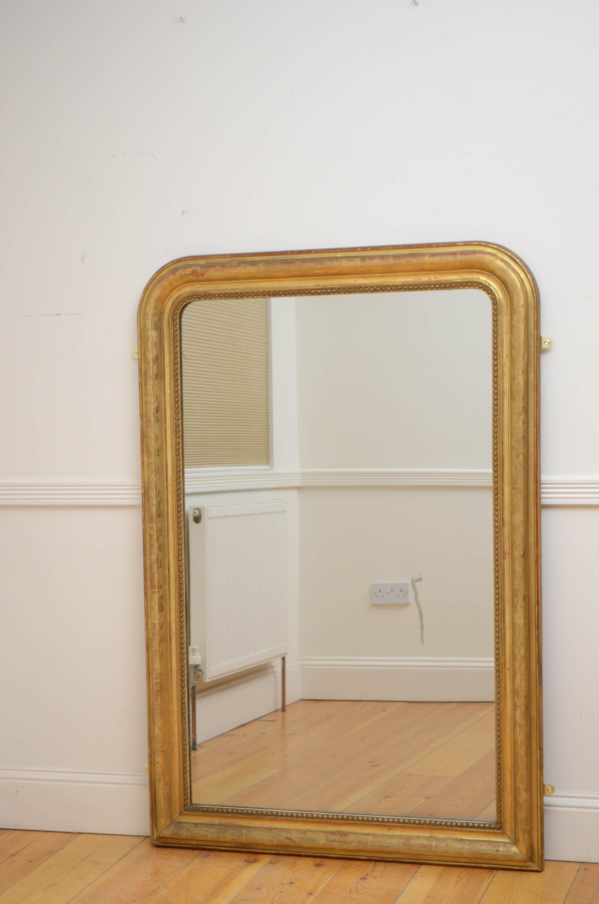Sn5173 Attractive XIXth century gilt wall or pier mirror, having original glass with some imperfections - please see photos, in beaded and moulded frame with floral decoration. This antique mirror retains its original glass, original gilt and