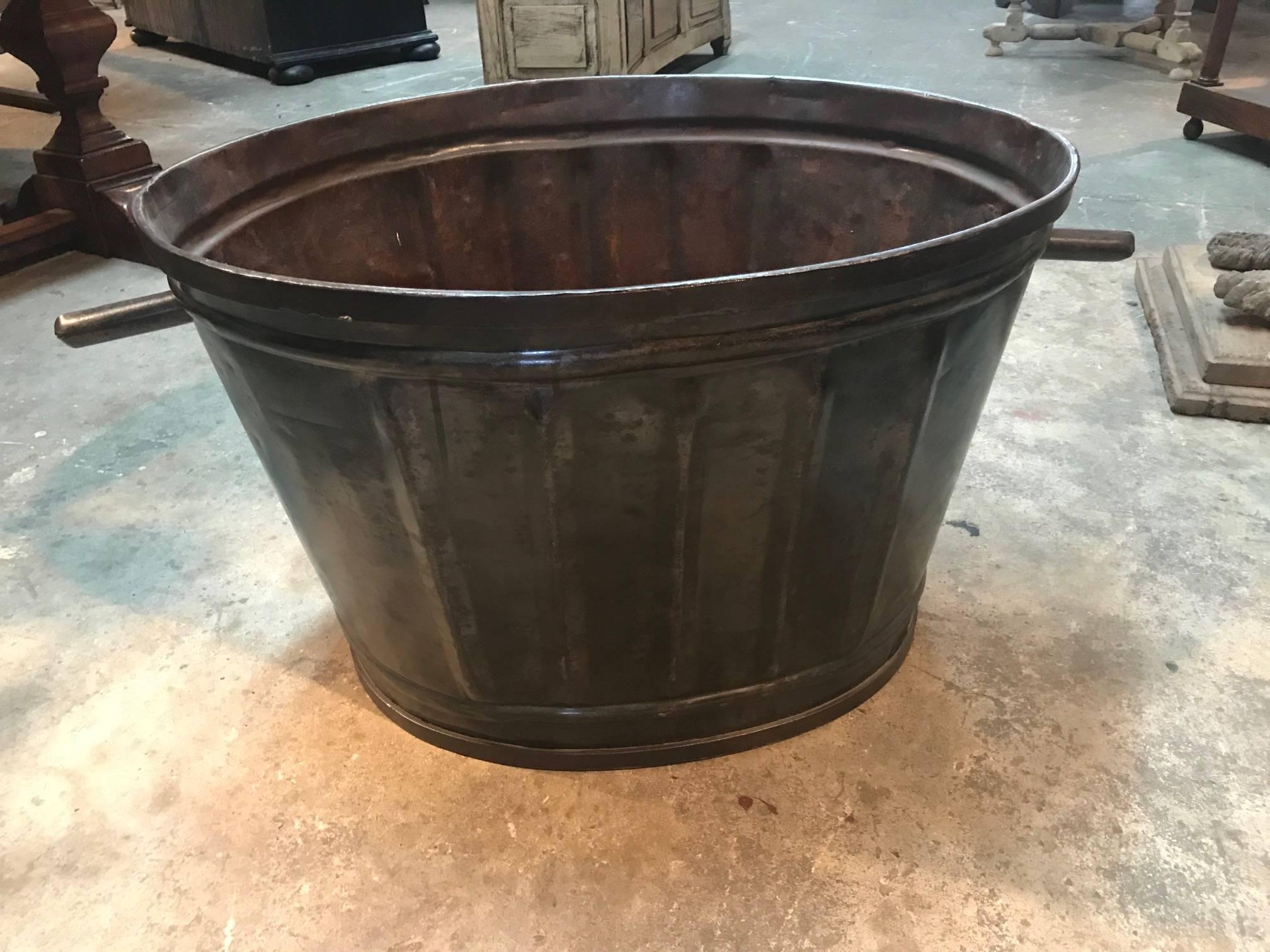 Wonderful later 19th century grape harvesting baskets - Buckets from a vineyard in the South of France. Soundly made from metal with handles. Terrific to use pool side for beach towels, by the fireplace for kindling or as jardiniers or planters.