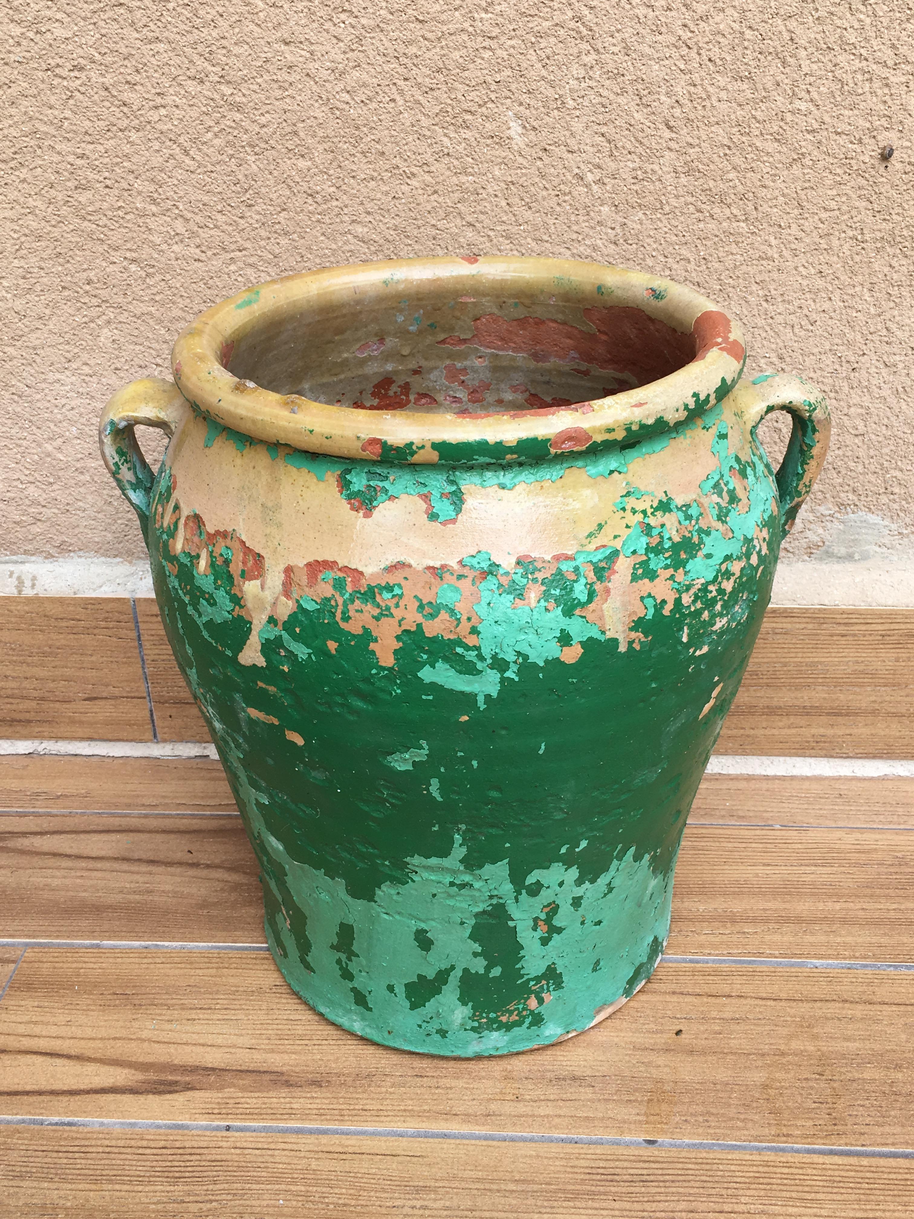 A jar produced in the South of France, circa 19th century. Terra cotta with original patina. Originally used as storage containers for olives.
We love the intense green glaze planter. Of medium size, you can potted up with herbs or lettuces for an