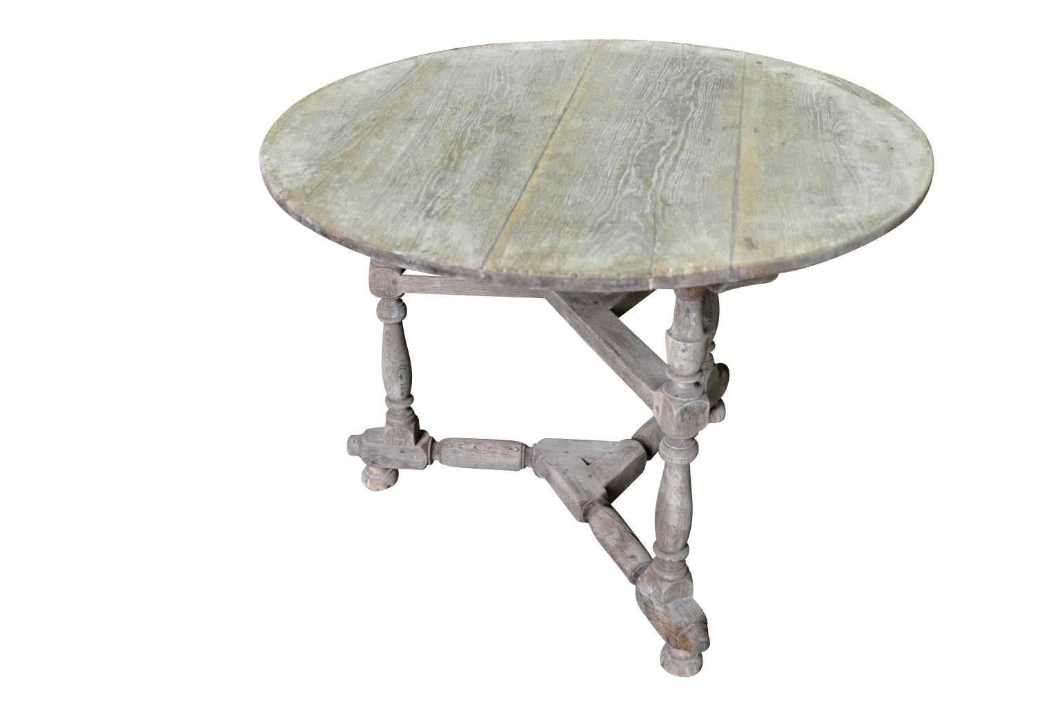 A very charming French later 19th century gueridon - table base in washed chestnut. A wonderful occasional table for any primitive interior of porch.