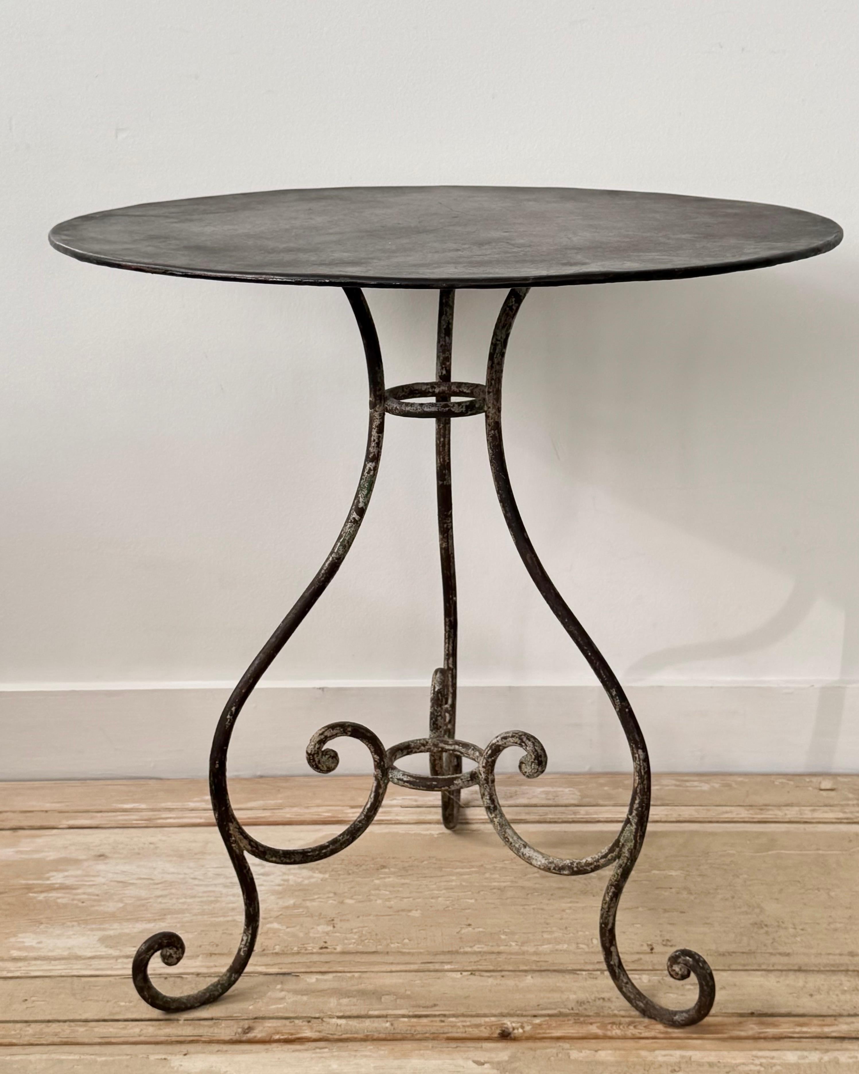19th century French Bistro table with round top on guéridon base of tree curved legs ending in scroll feet and joined by central stretcher - all in super old patina.
Available two very similar bistros.
Please see our storefront photos.

