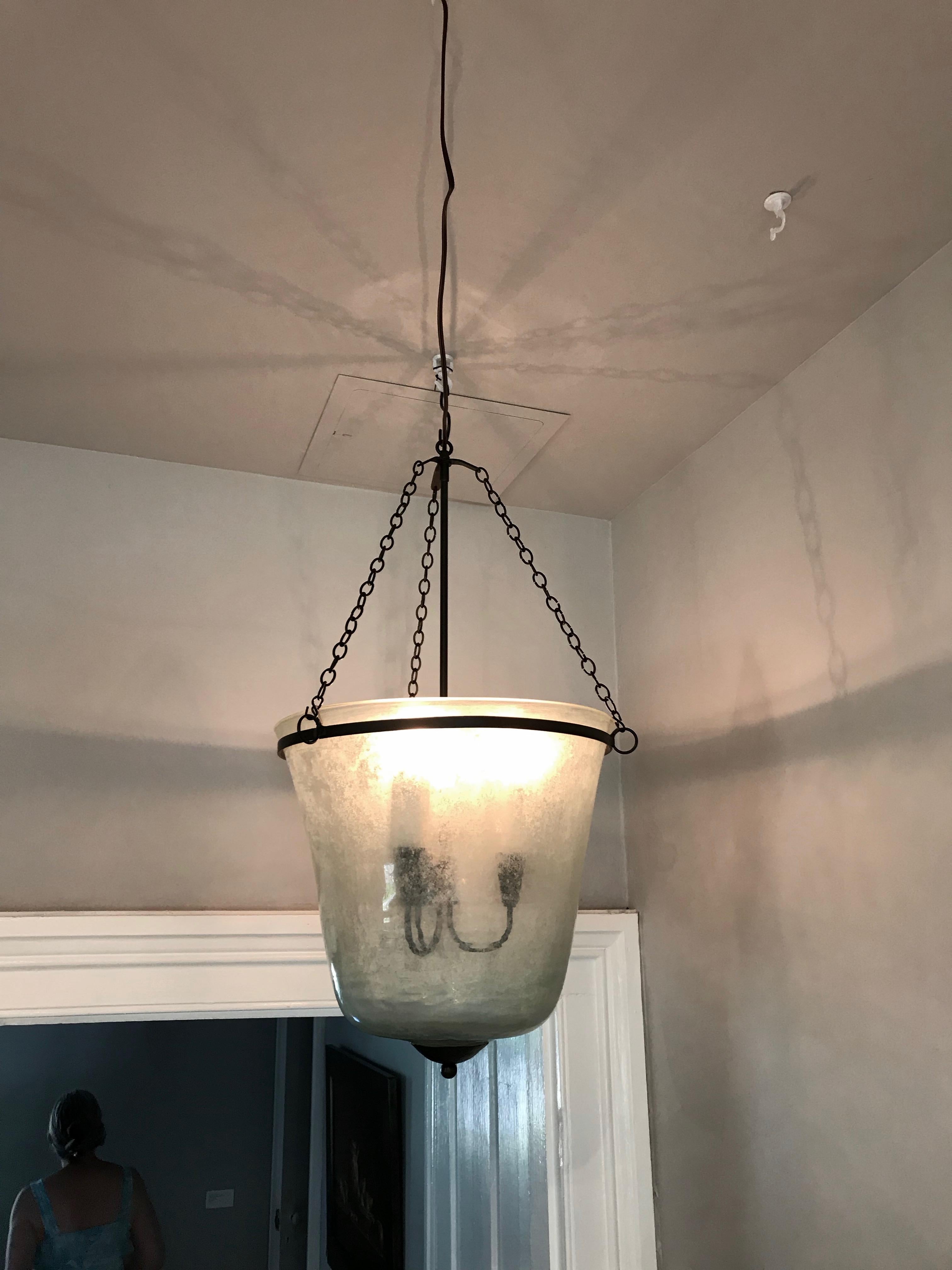 We have always had a thing for hand blown French garden cloches that come in two configurations: bell form and melon form. This one is a bell cloche (a little taller and more narrow than a melon cloche) and it has been converted into a hanging light