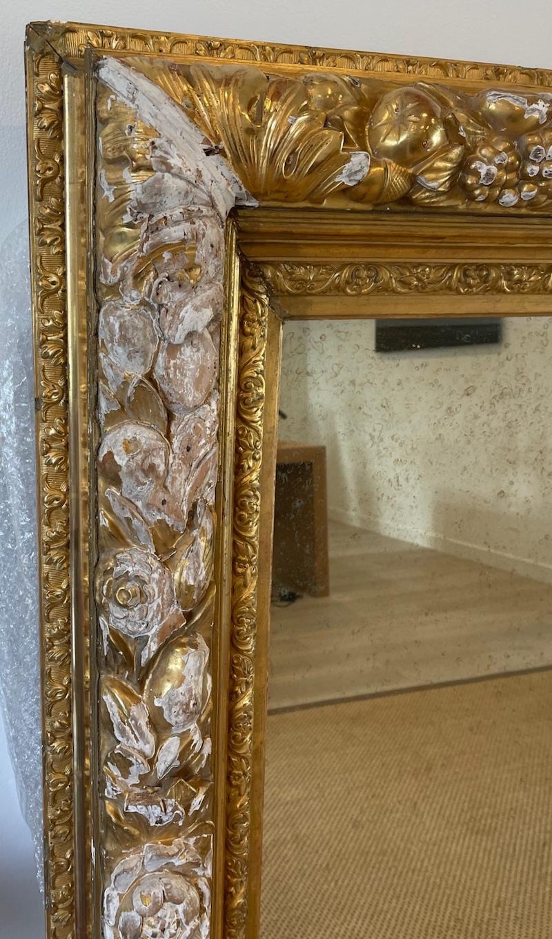 French 19th century hand-carved gold-leaf Louis XVI mirror.