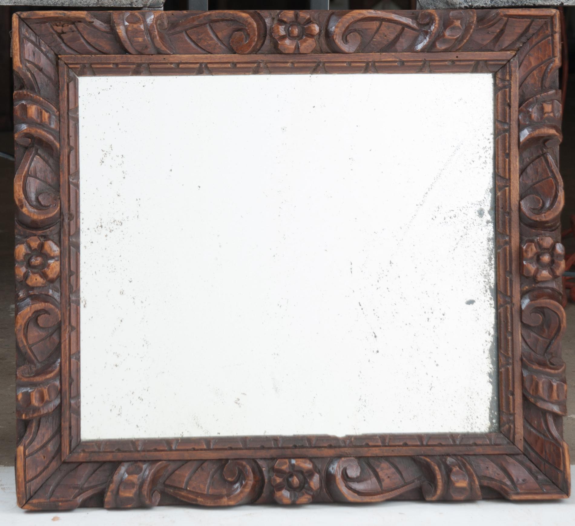 Wonderful little mirror from France. Hand carved in the early 1800s with wonderful movement and floral designs. Mirror may be more recent, but has some wonderful foxing.