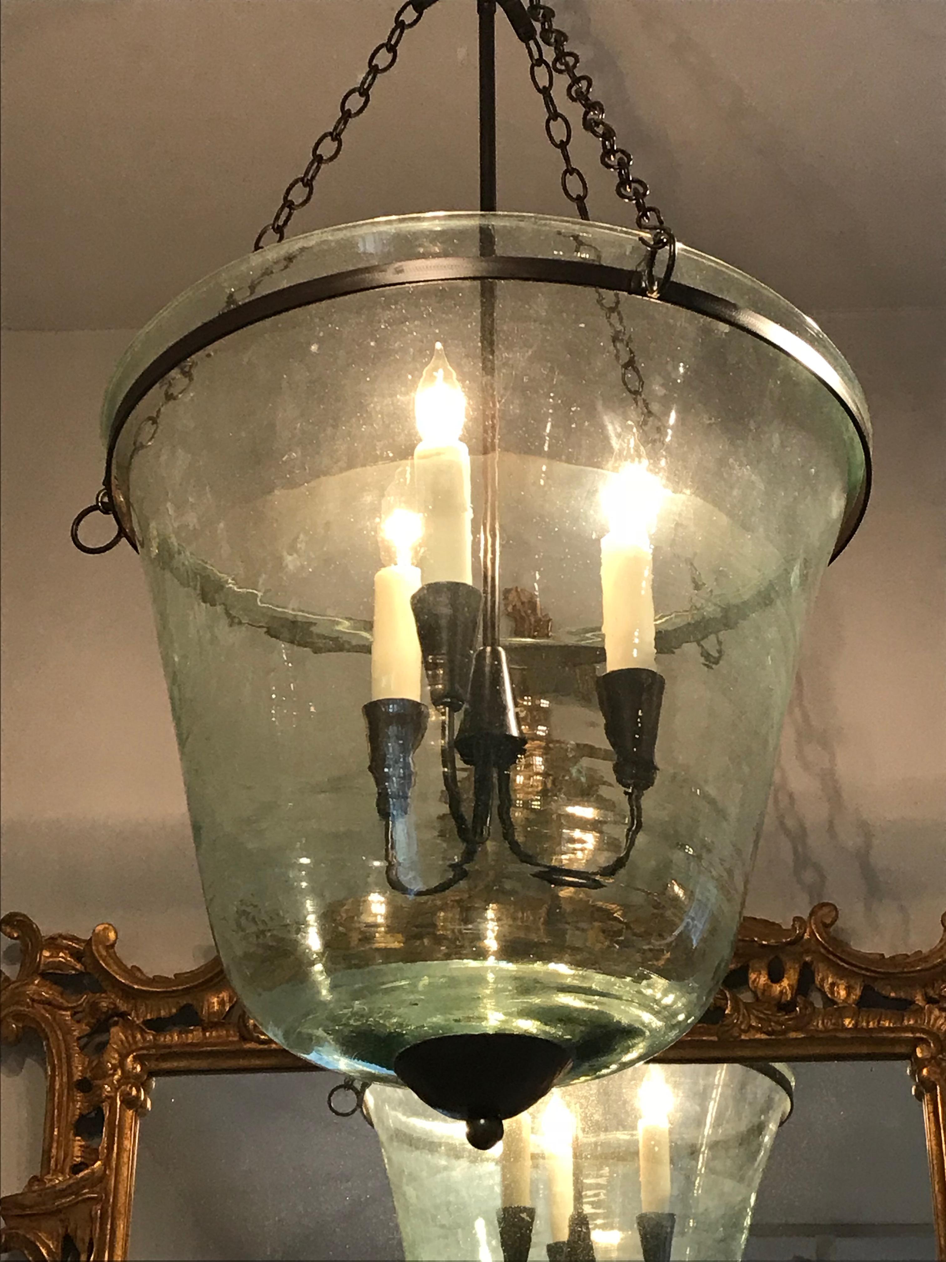 We have always had a thing for hand-blown French garden cloches that come in two configurations, bell form and melon form. This one is a bell cloche (a little taller and more narrow than a melon cloche) and it has been converted into a hanging light