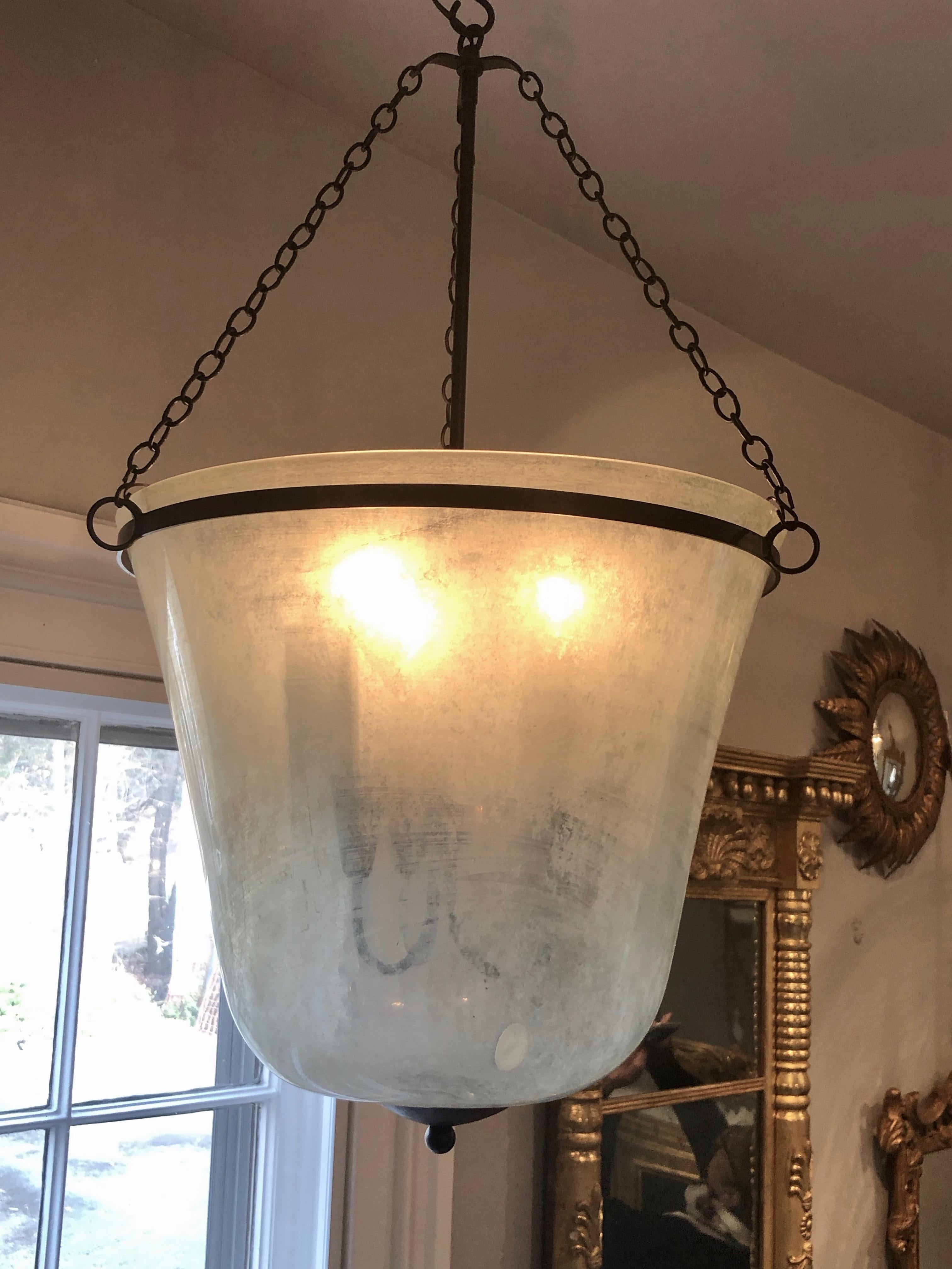 We have always had a thing for hand blown French garden cloches that come in two configurations, bell form and melon form. This one is a bell cloche (a little taller and more narrow than a melon cloche) and it has been converted into a hanging light