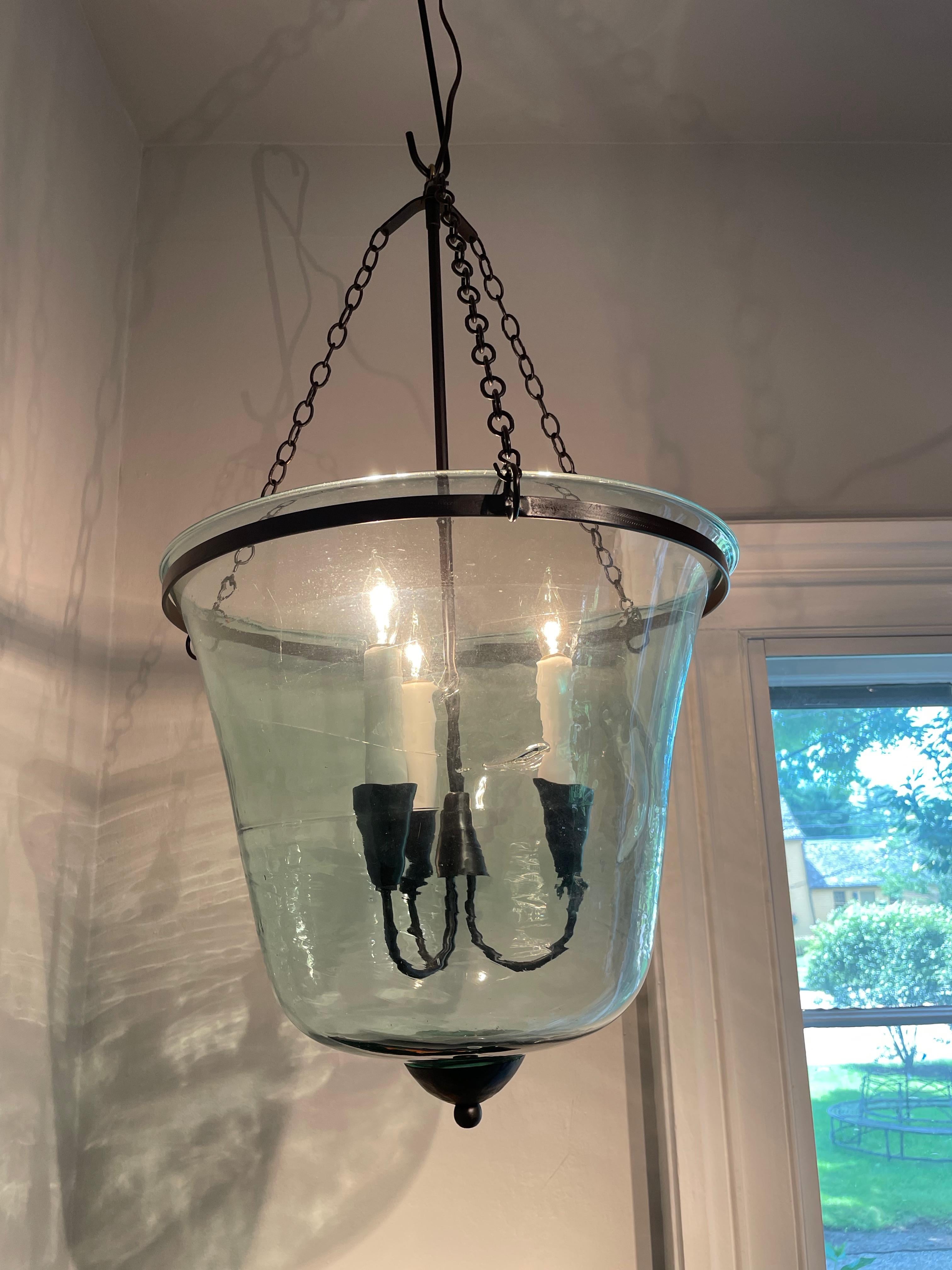 We have always had a thing for hand-blown French garden cloches that come in two configurations: bell form and melon form. This one is a bell cloche (a little taller and more narrow than a melon cloche) and it has been converted into a hanging light