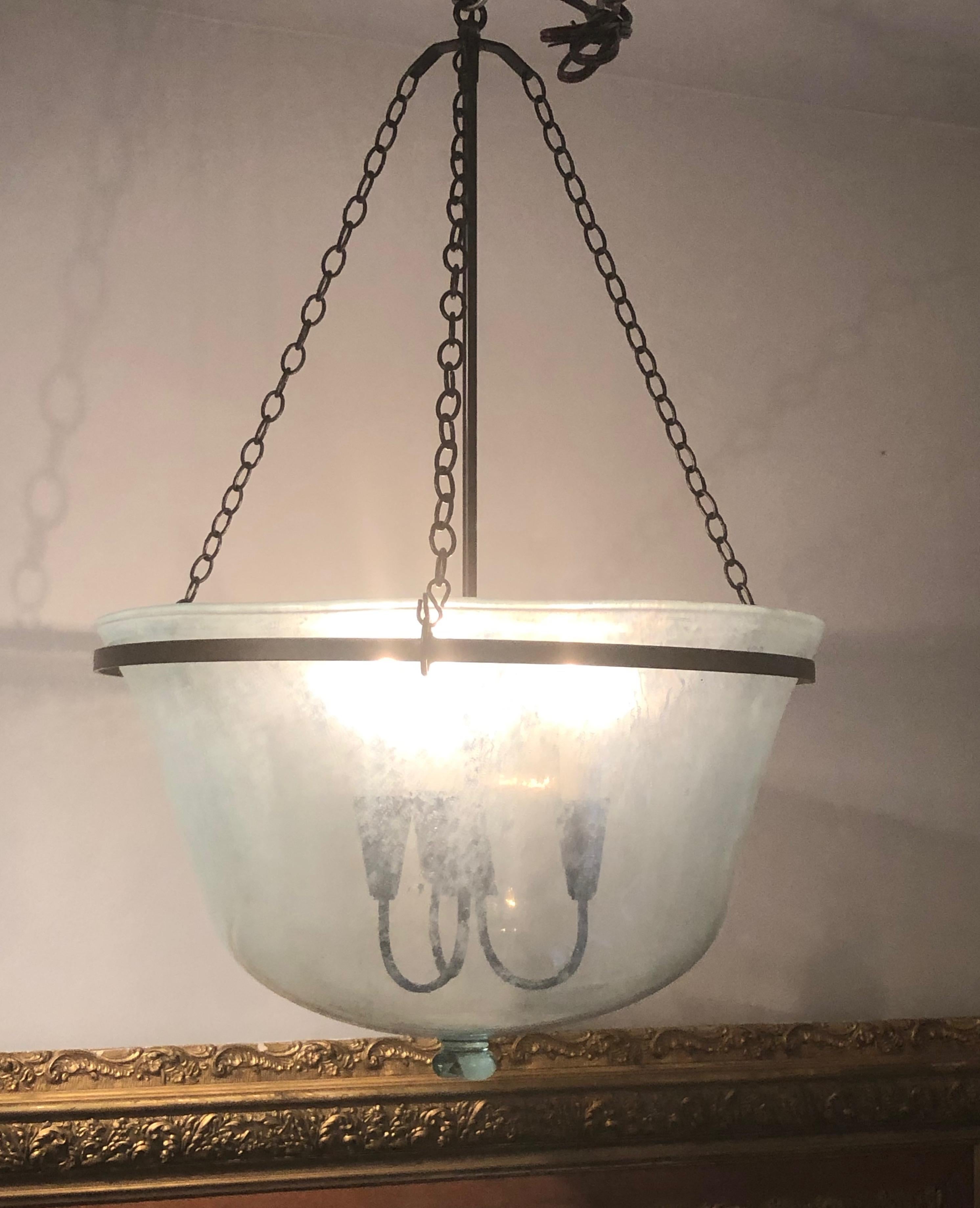 We have always had a thing for hand blown French garden cloches that come in two configurations, bell form and melon form. This one is a melon cloche (a little shorter and wider than a bell cloche) and it has been converted into a hanging light with