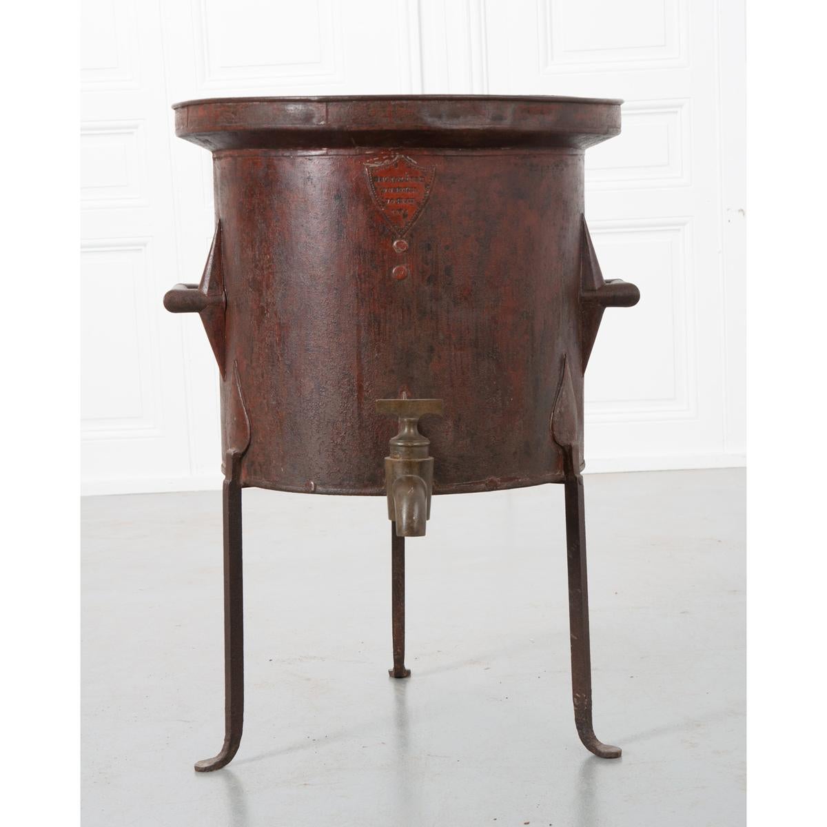 This rare, painted tole and brass wine barrel was used by wineries to measure and pour their wines into bottles in preparation for consumption or sale. The tole and old paint have developed a wonderful patina over time. It is mounted with a pair of