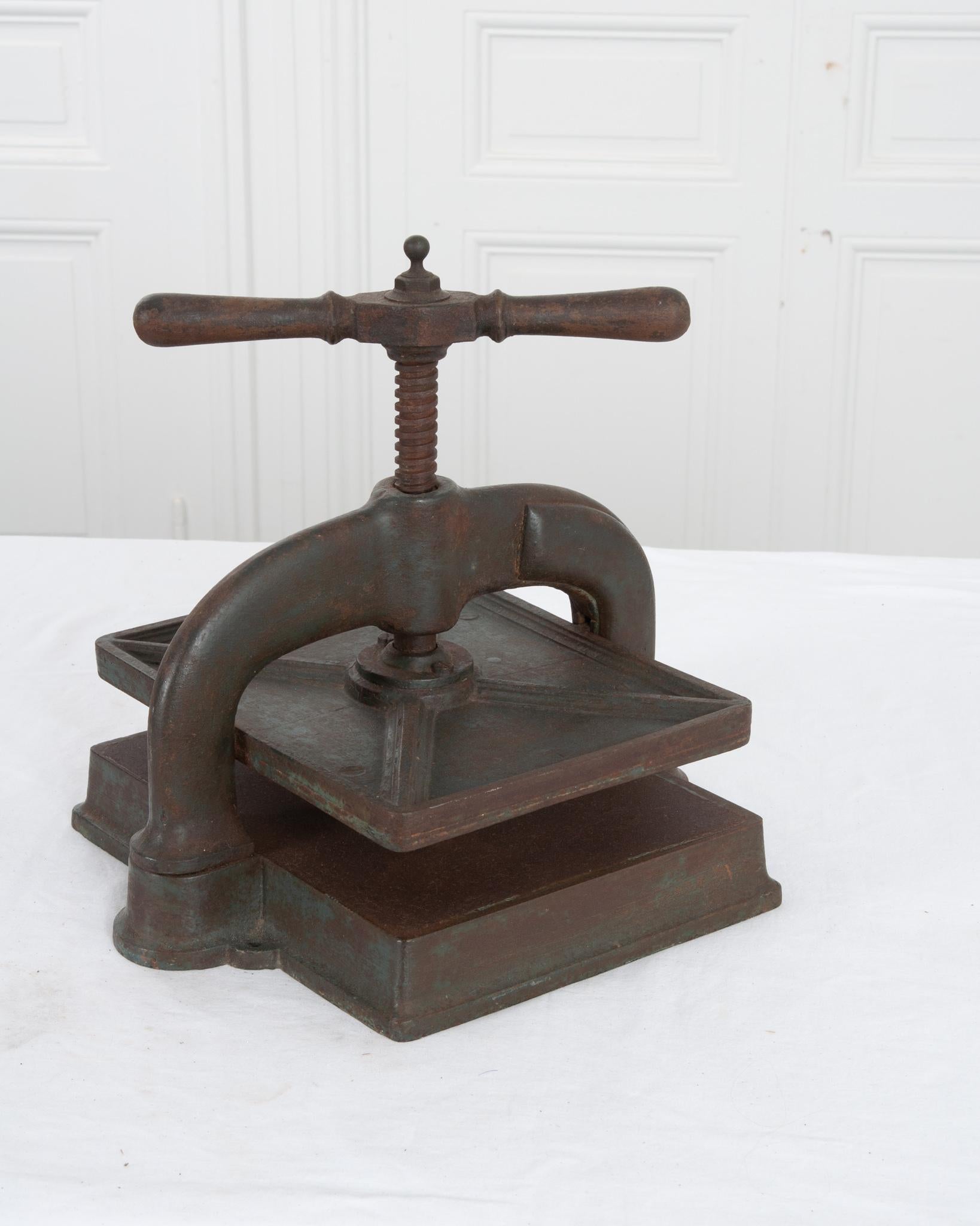 This antique paper binding press was forged in 19th century France. The classic 