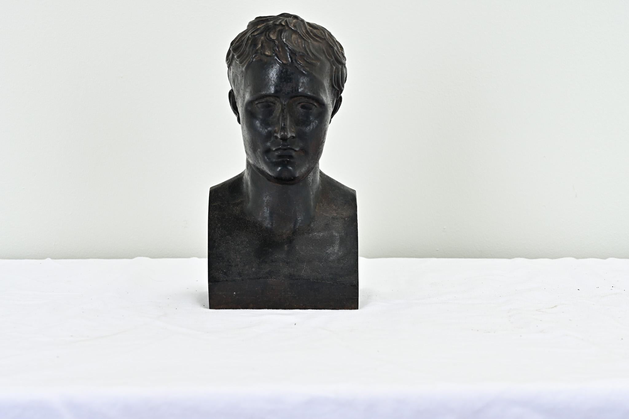 A European bust of a man made most likely taken from a larger antique fireplace fender. This iron bust has a hollow interior with impressive details found throughout. Be sure to view the detailed images to see every angle.
