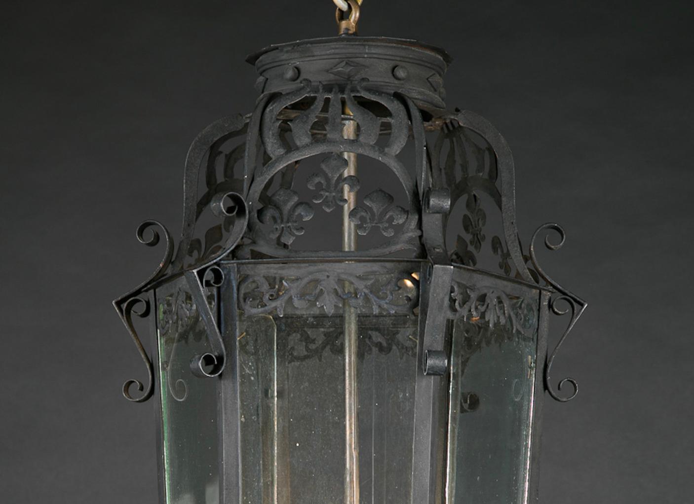 French 19th Century Iron Hanging Lantern with Groups of Fleur De Lis at Top In Good Condition For Sale In New Orleans, LA