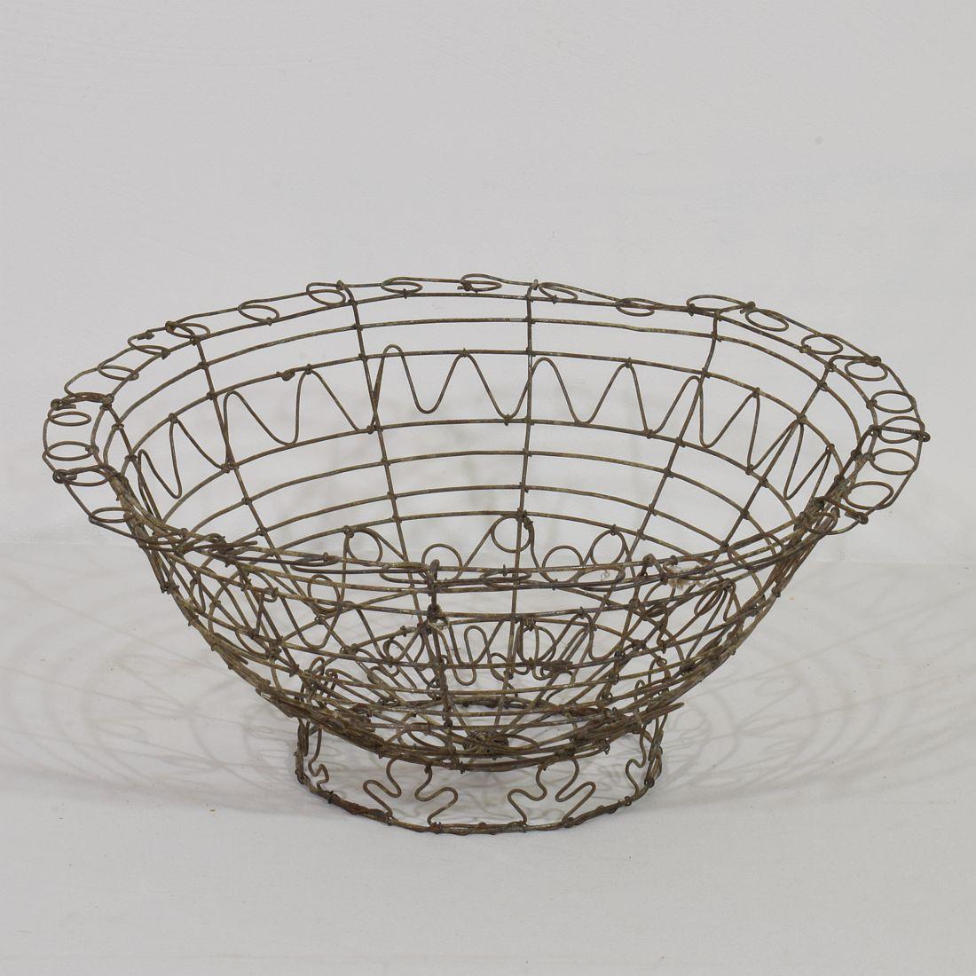 Lovely handmade iron wirework basket . Very nicely made and a great statement on your countertop or table.
France, circa 1850-1900.
Weathered.
